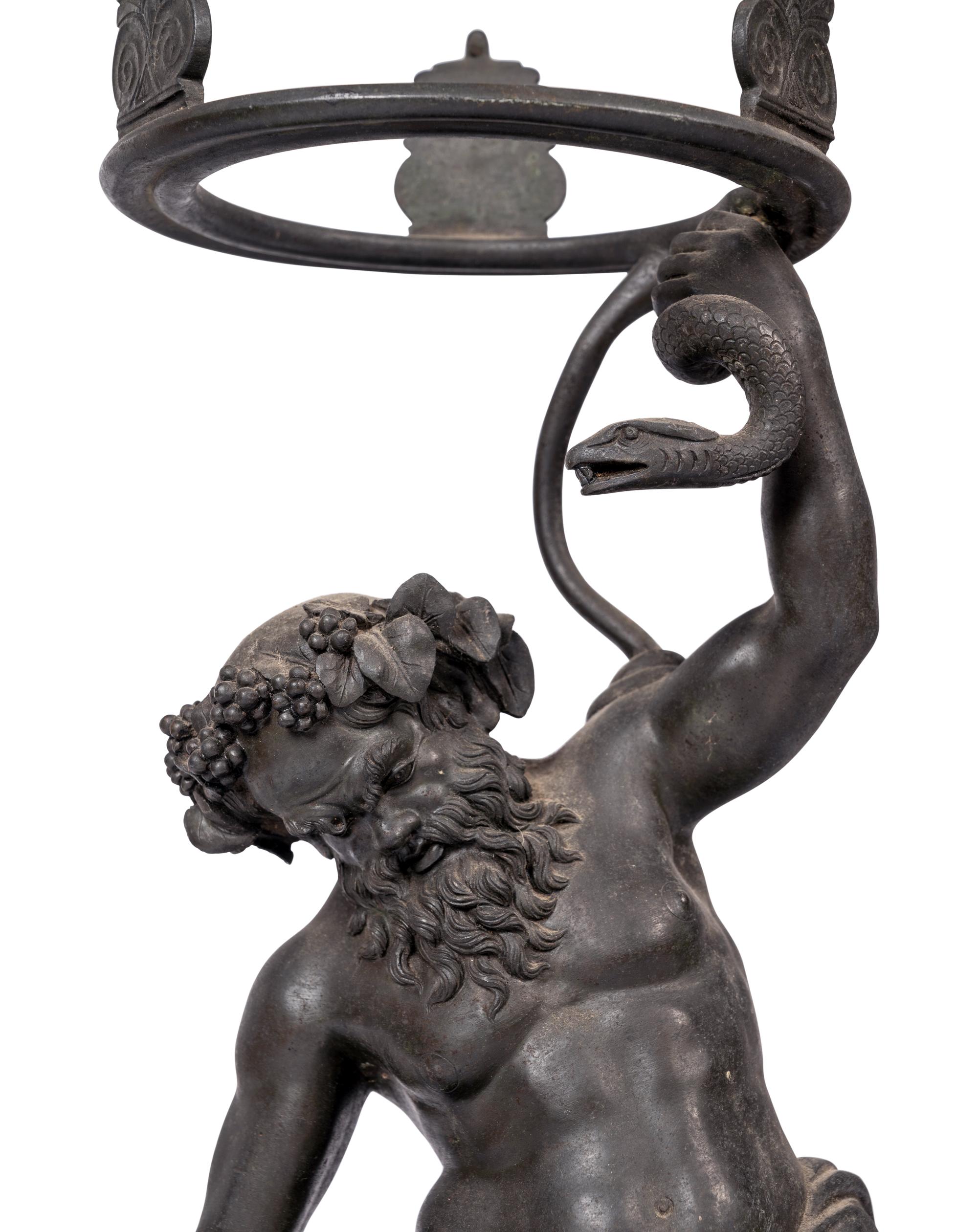 A Grand Tour Bronze Figure of Silenus Wrestling a Serpent