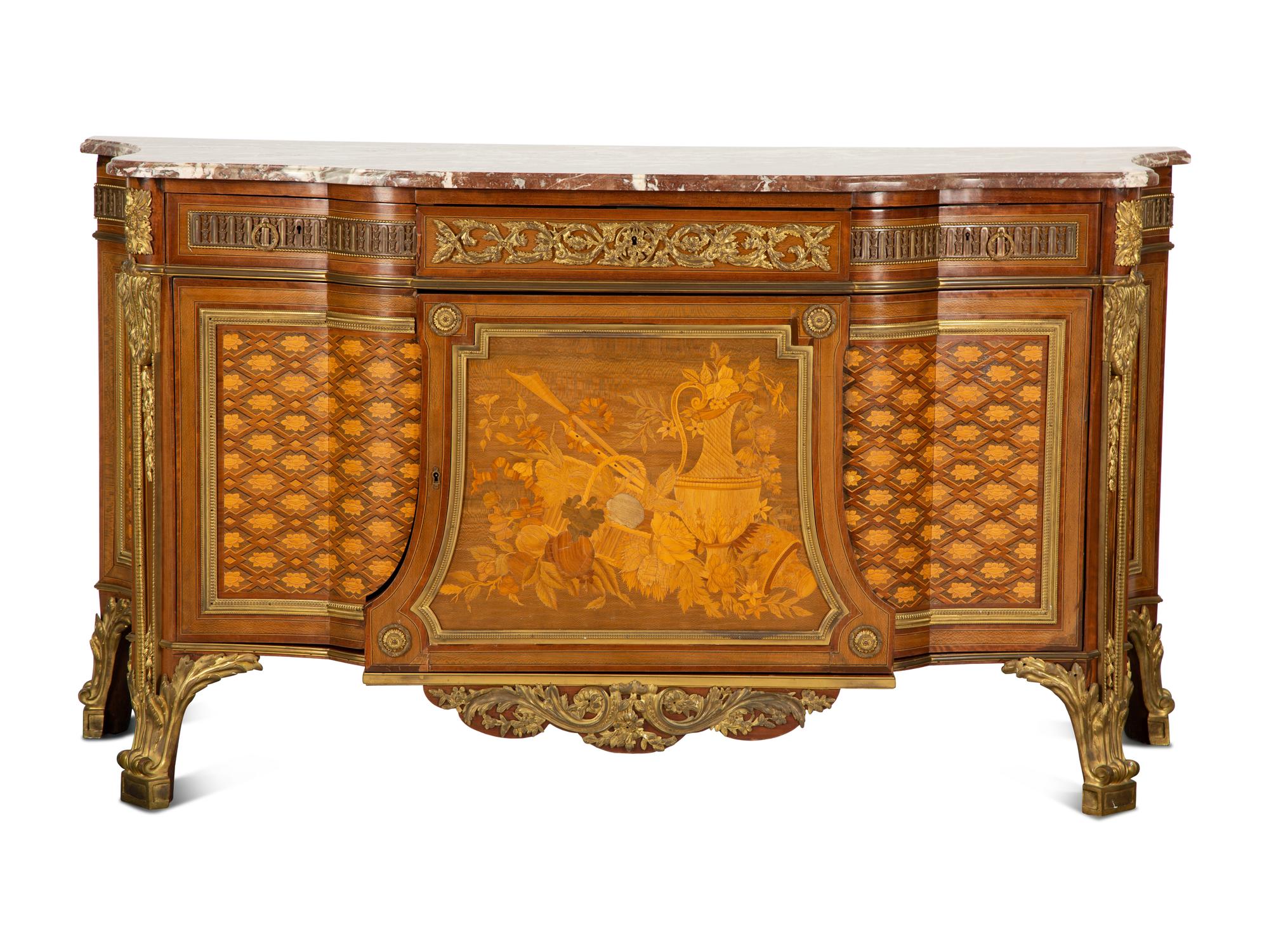 A Louis XVI Style Gilt Bronze Mounted Kingwood and Marquetry Marble-Top Commode