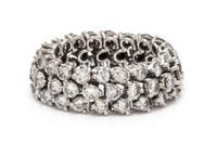 A Platinum and Diamond Flexible Band Ring, 5.77 dwts.