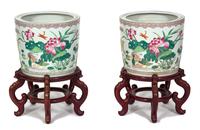 A Pair of Chinese Export Famille Rose Porcelain Jardinieres Height 12 x diameter 14 1/4 inches.