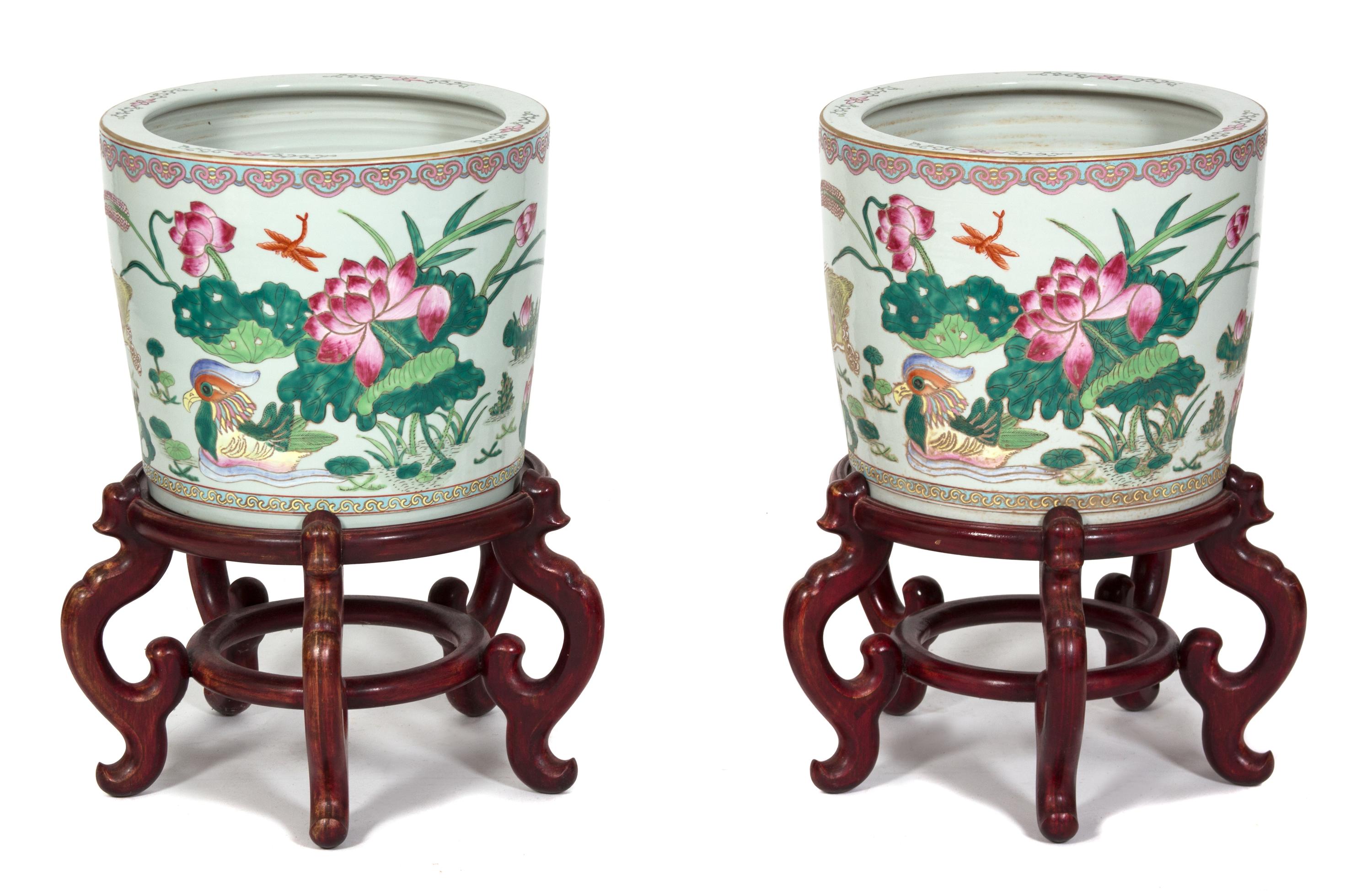A Pair of Chinese Export Famille Rose Porcelain Jardinieres Height 12 x diameter 14 1/4 inches.