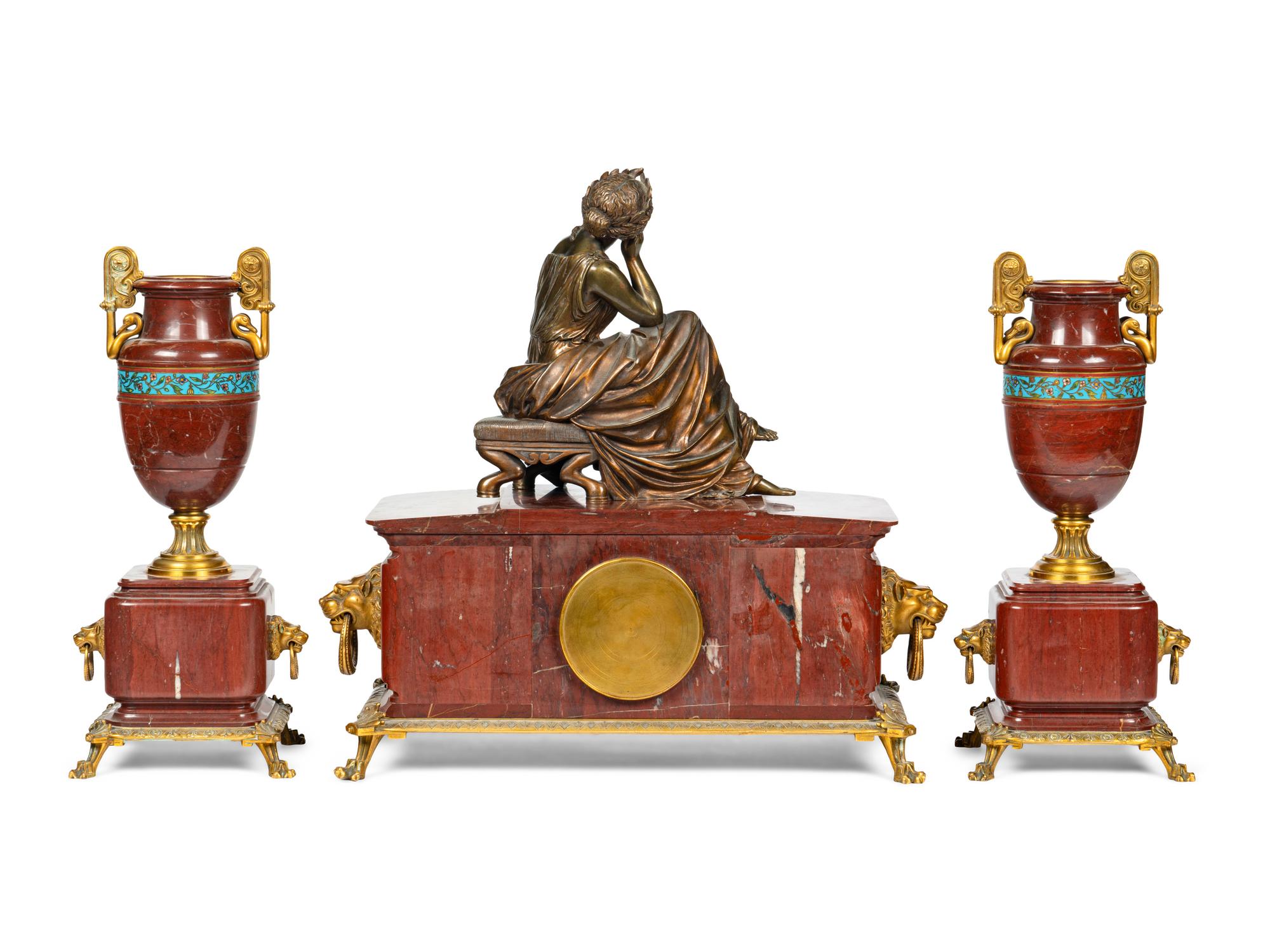 A French Bronze, Marble and Champlevé Clock Garniture