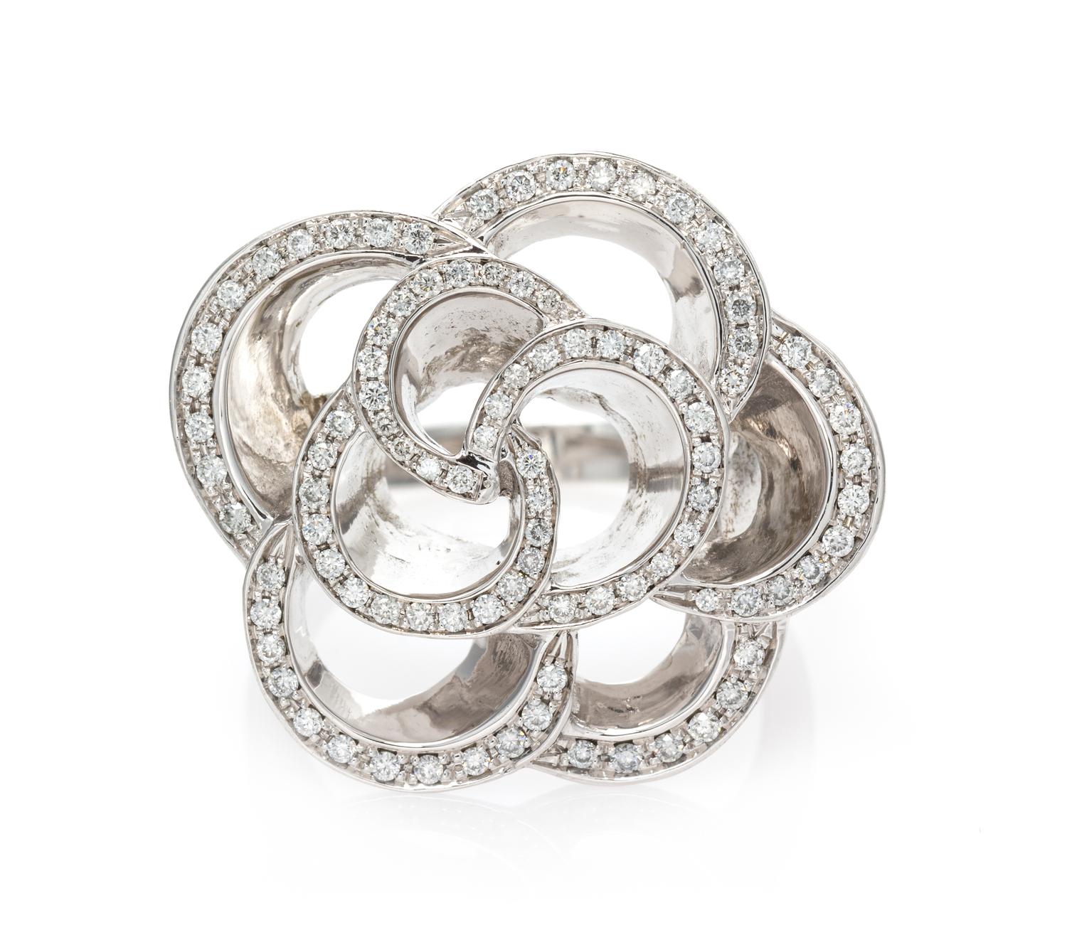 An 18 Karat White Gold and Diamond Floral Motif Ring, 12.15 dwts.