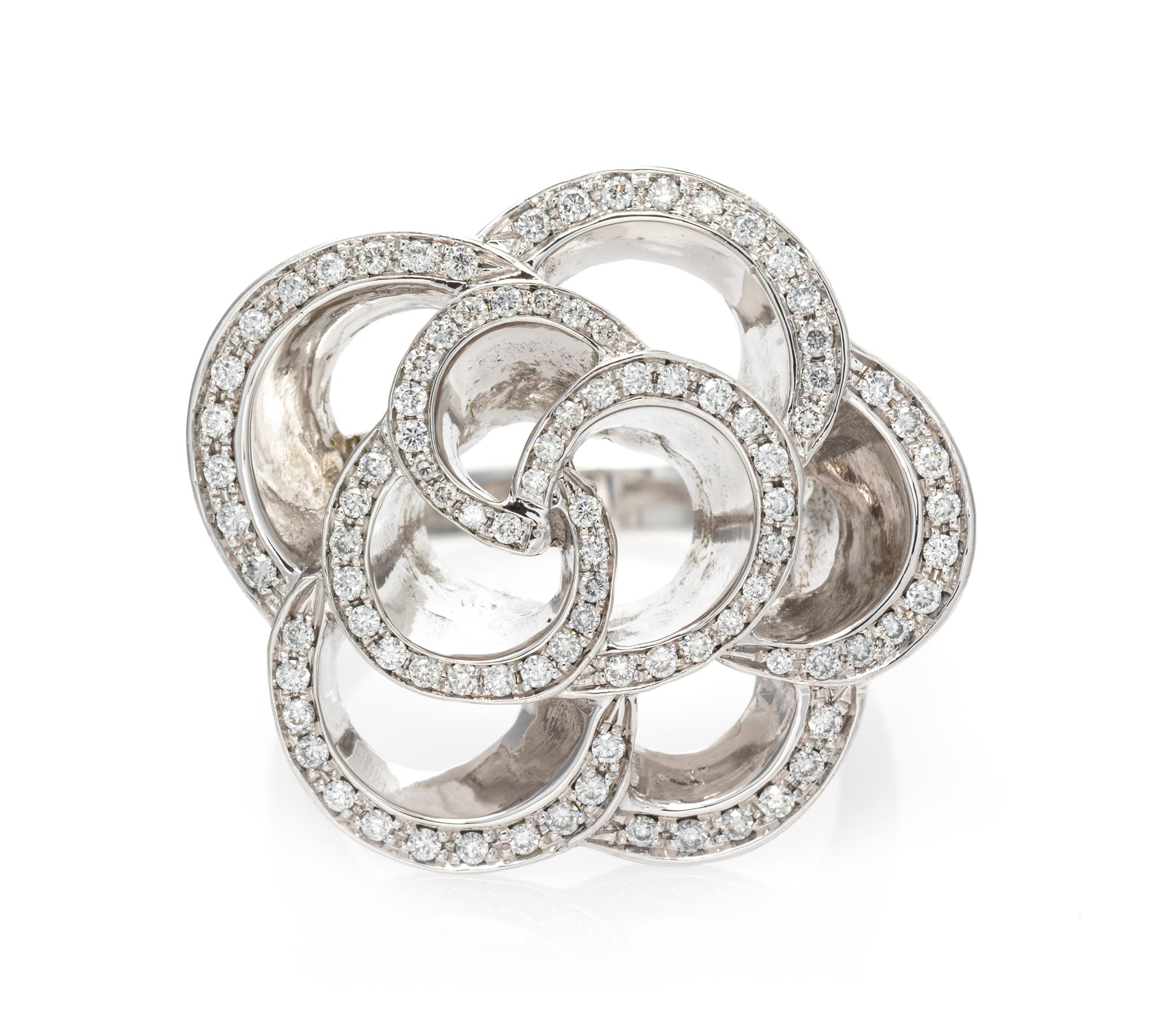 An 18 Karat White Gold and Diamond Floral Motif Ring, 12.15 dwts.