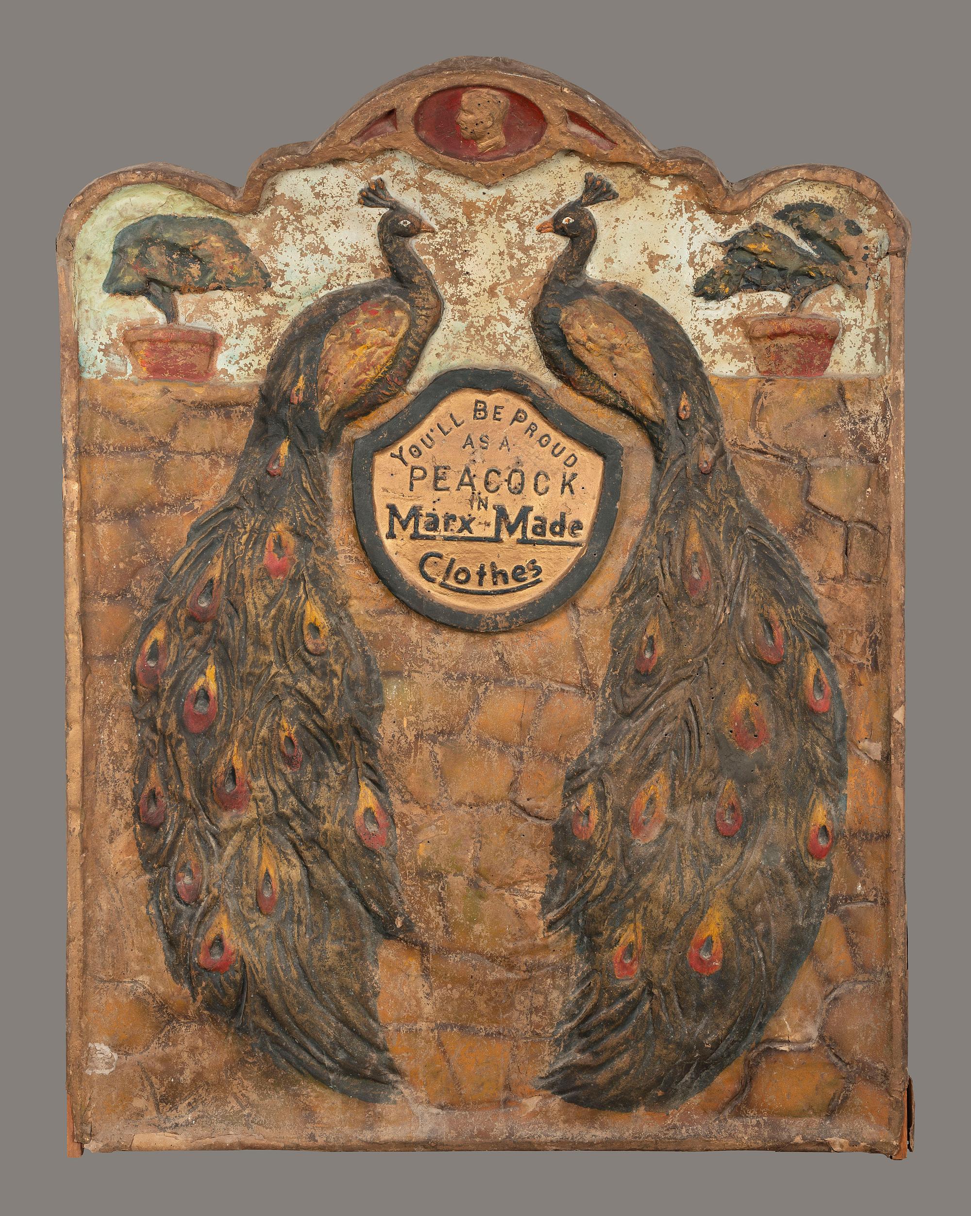 A 'Marx-Made' Clothes Peacock-Decorated Papier-Mache Advertising Sign