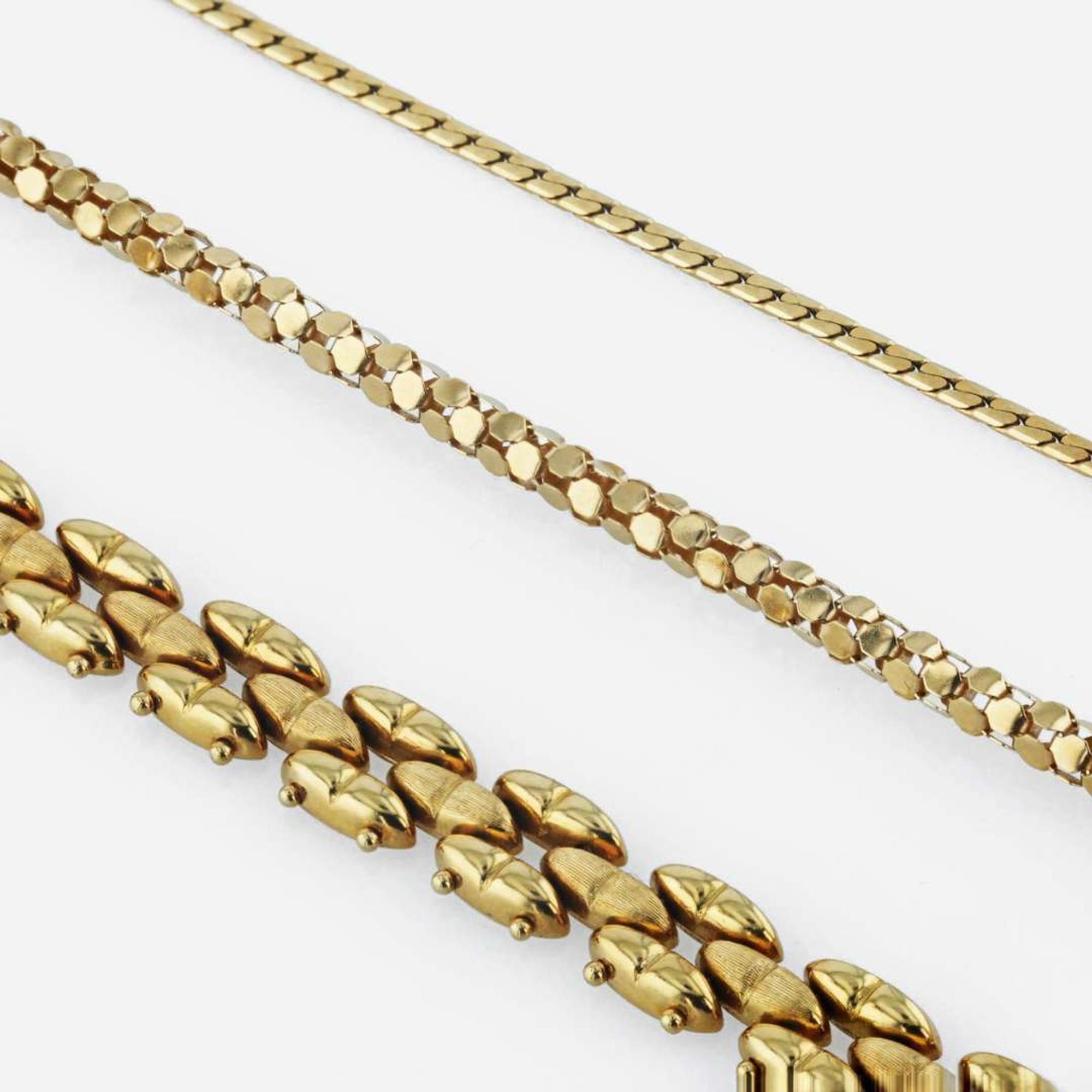 A group of gold necklaces