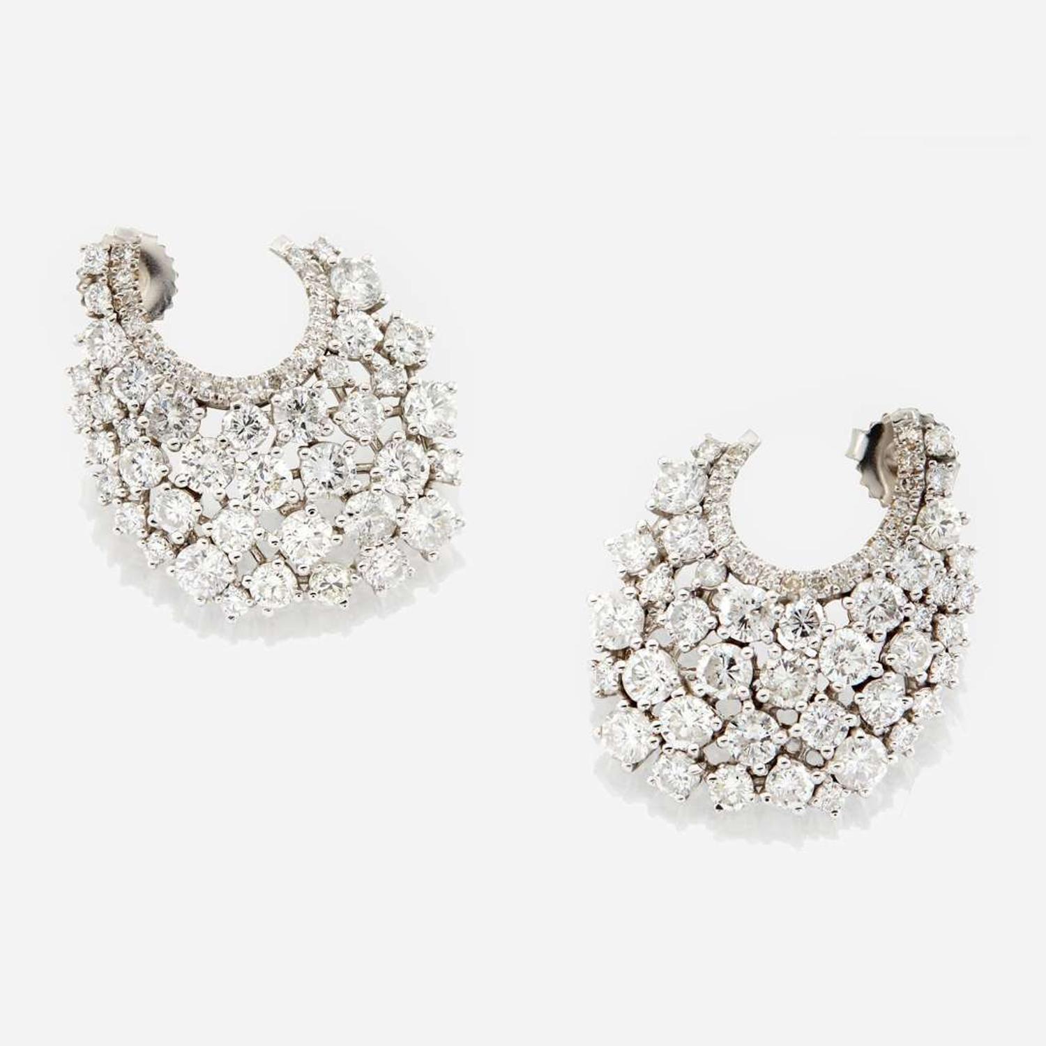 A pair of diamond and white gold earrings