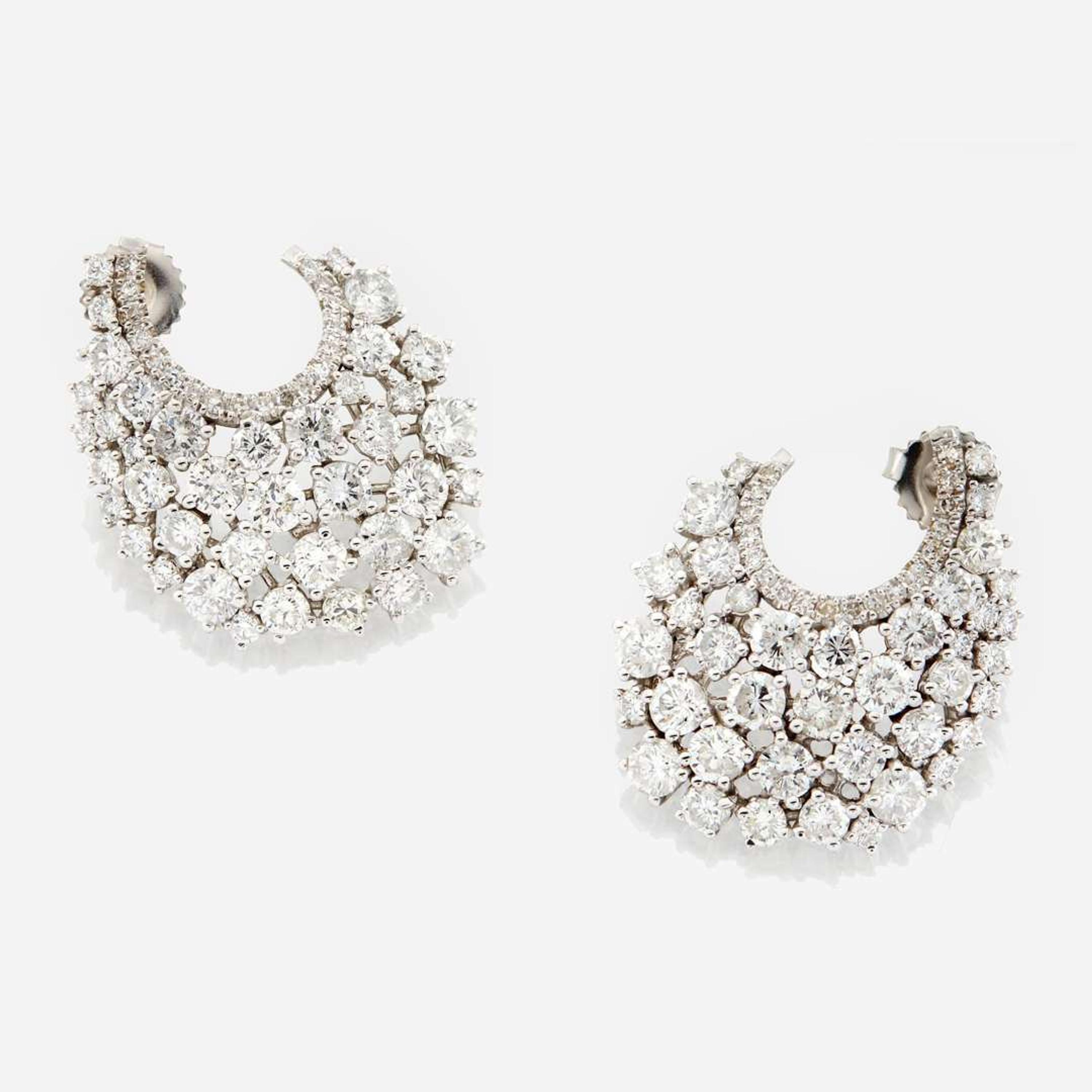 A pair of diamond and white gold earrings