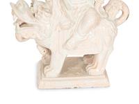 A Pair of Chinese Glazed Ceramic Figures of Guan Yin Atop a Foo Dog