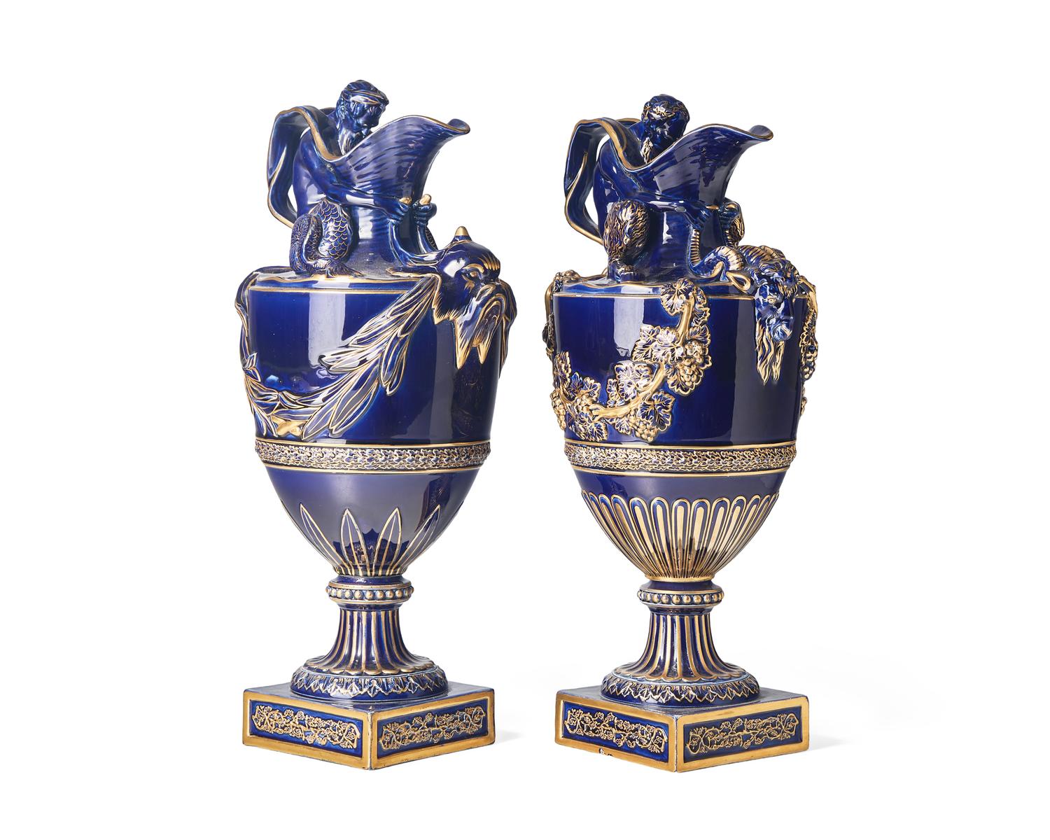 A Pair of Wedgwood Parcel Gilt Cobalt Glazed Ewers