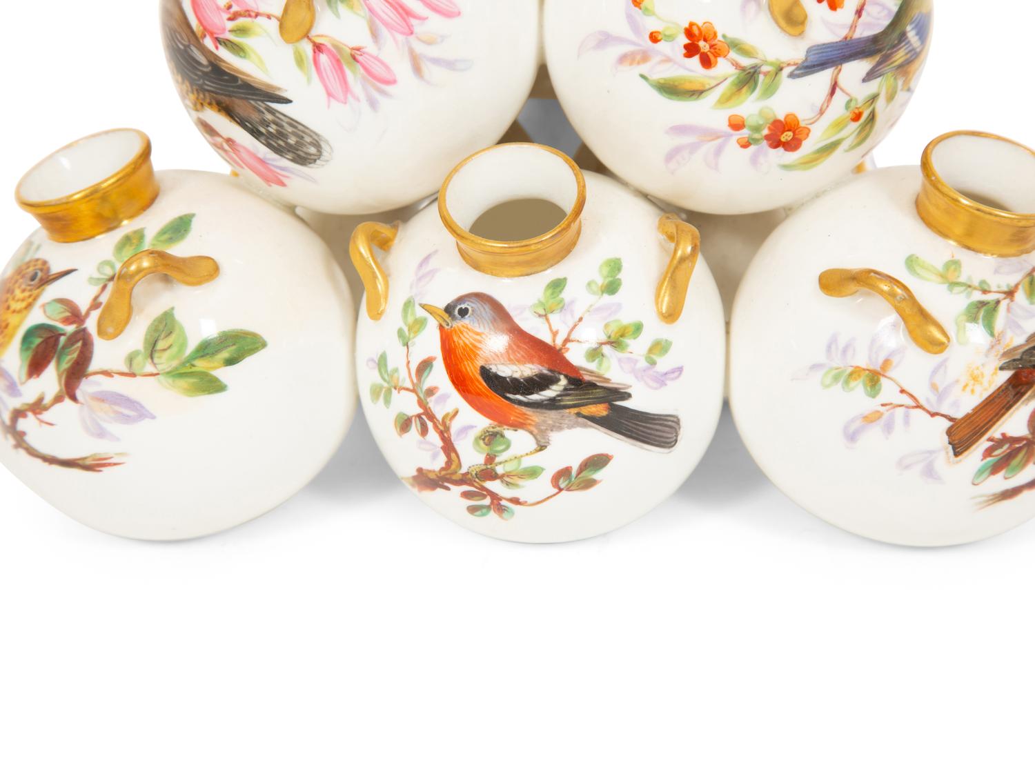 A Royal Worcester Porcelain Multi-stack of Ten Vases with Hand Painted Bird Decoration