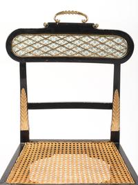 A Pair of Neoclassical Style Ebonized Curule Side Chairs