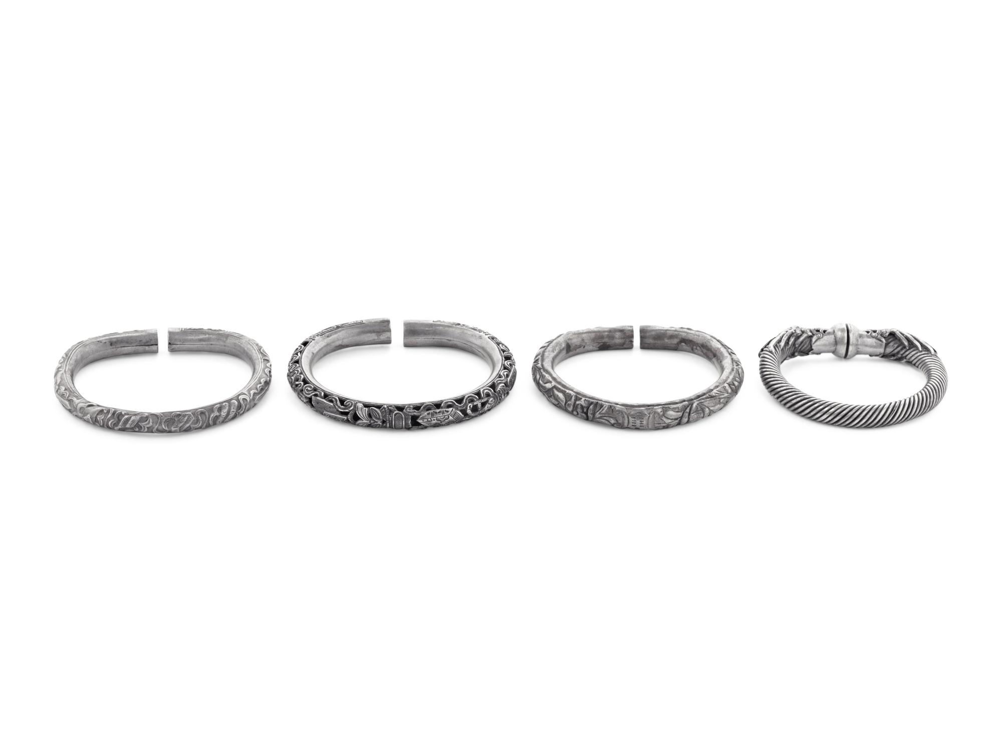 Four Chinese Silvered Metal Bangles