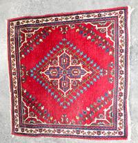 A Persian Mat 2 feet 9 inches x 2 feet 8 inches.