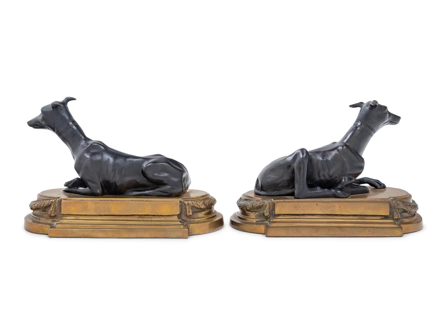 A Pair of Gilt and Patinated Bronze Figures of Whippets
