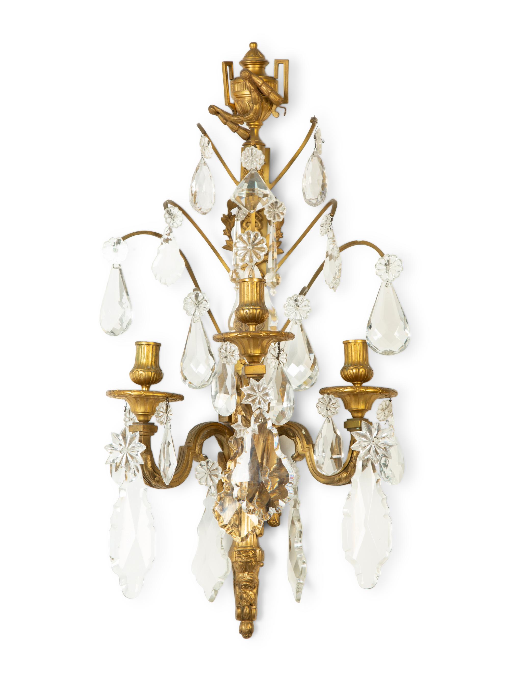 A Pair of Louis XVI Style Gilt Bronze and Cut Glass Three-Light Sconces