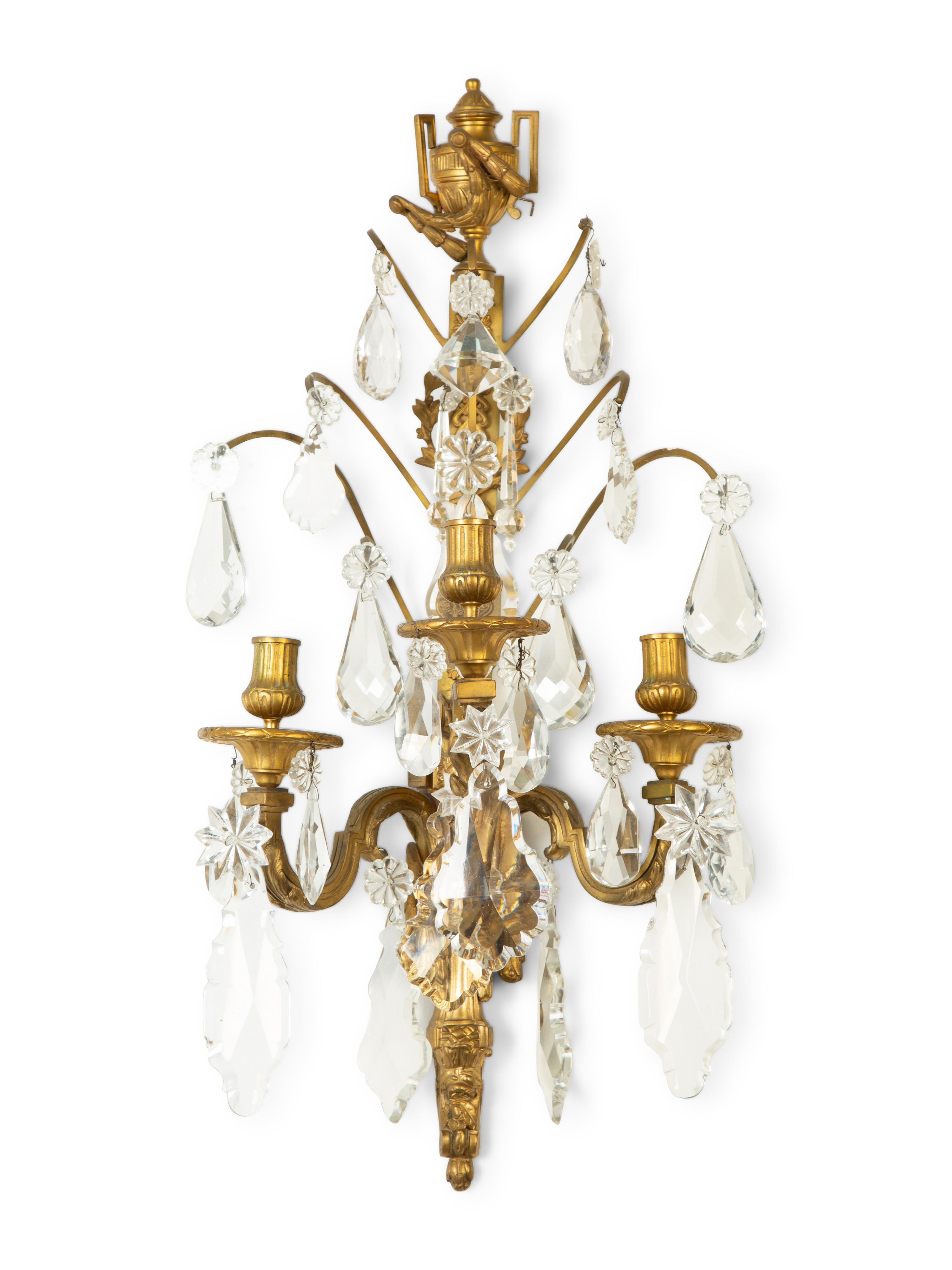 A Pair of Louis XVI Style Gilt Bronze and Cut Glass Three-Light Sconces