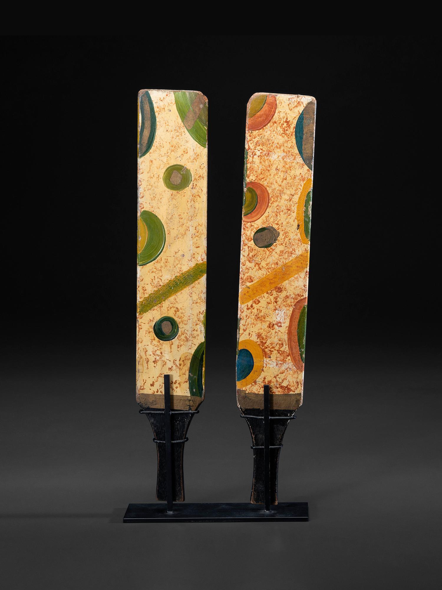 A Pair of Paint Decorated Game Paddles