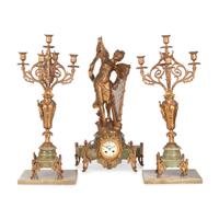 A Neoclassical Gilt Metal and Onyx Clock Garniture