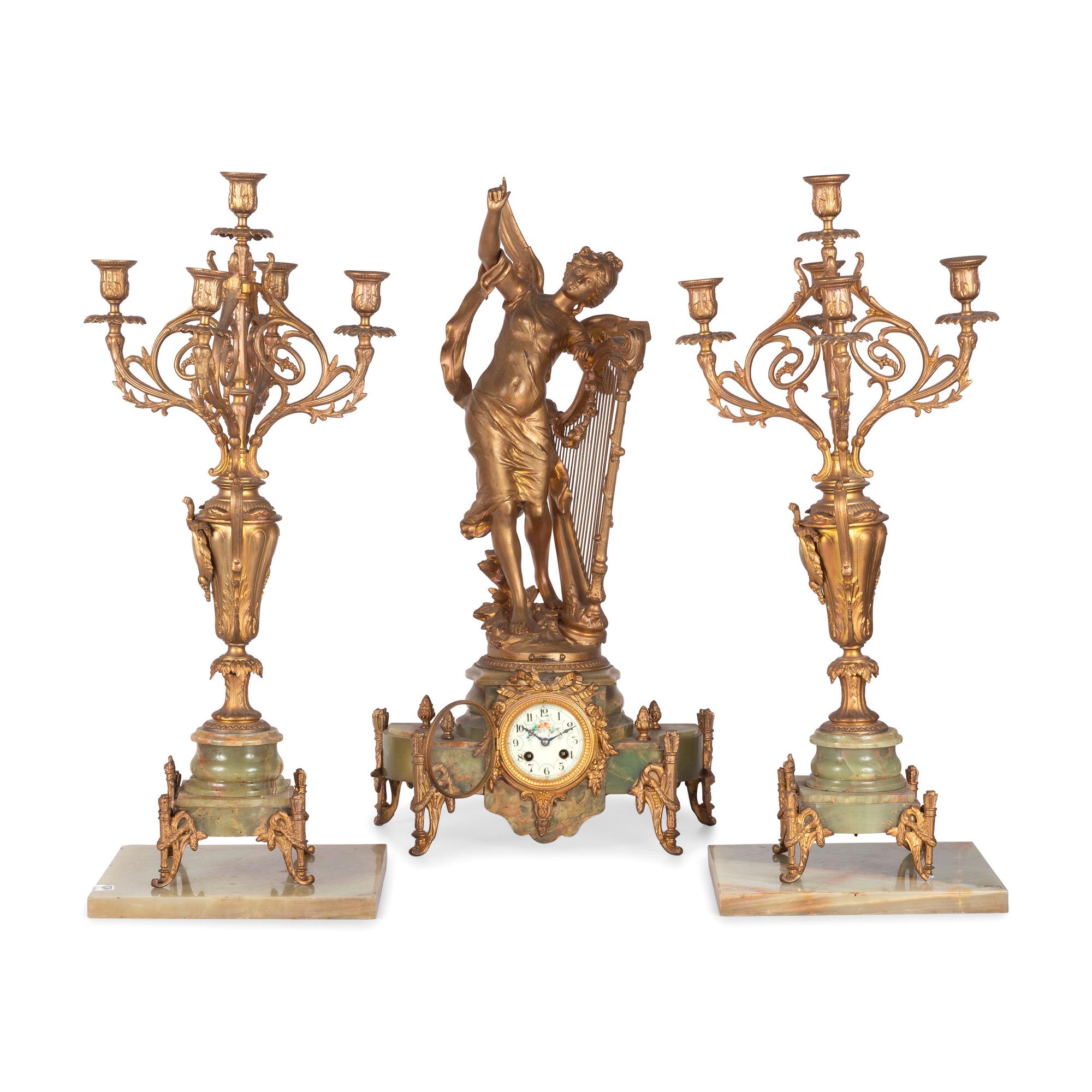 A Neoclassical Gilt Metal and Onyx Clock Garniture