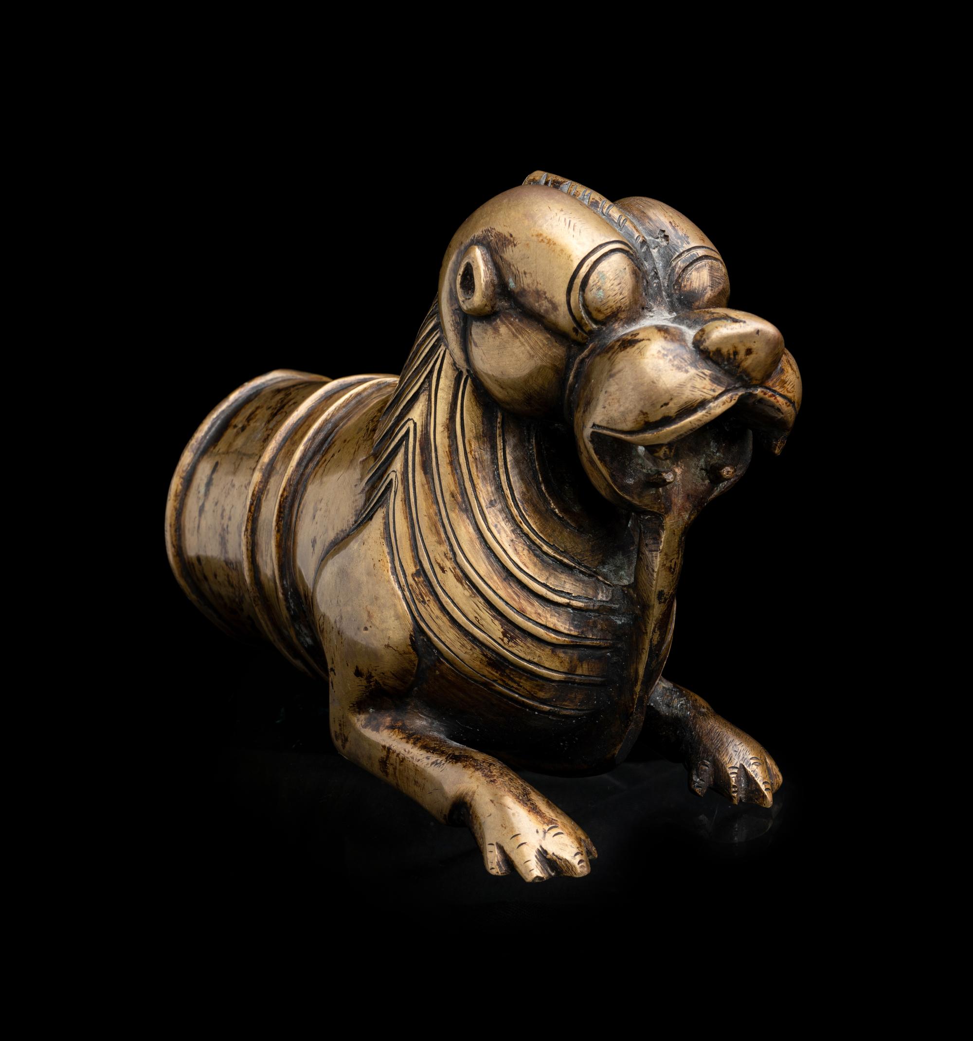 An Indian Cast Brass Lion-Form Palki Handle