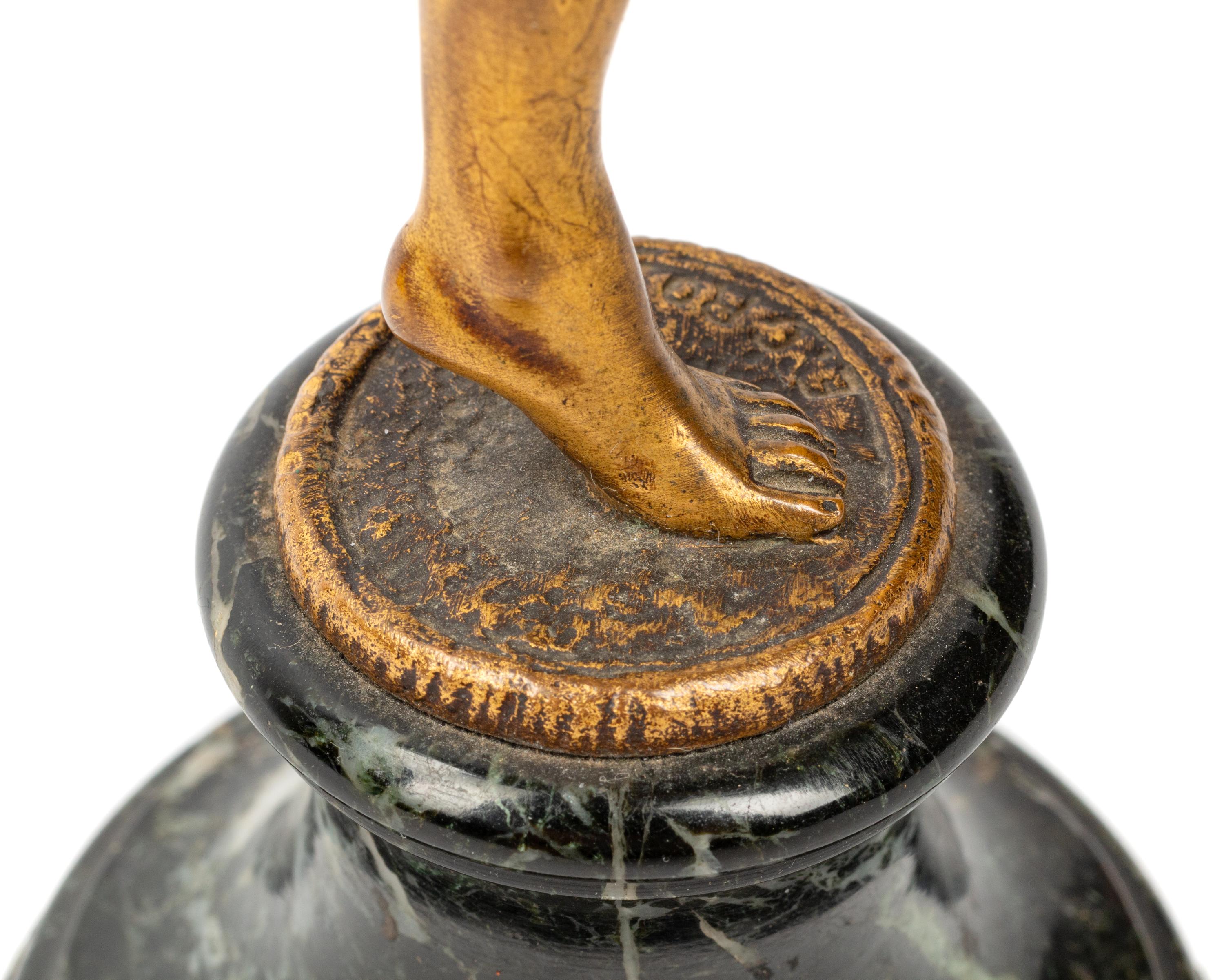 A French Gilt Bronze Figure on a Marble Base