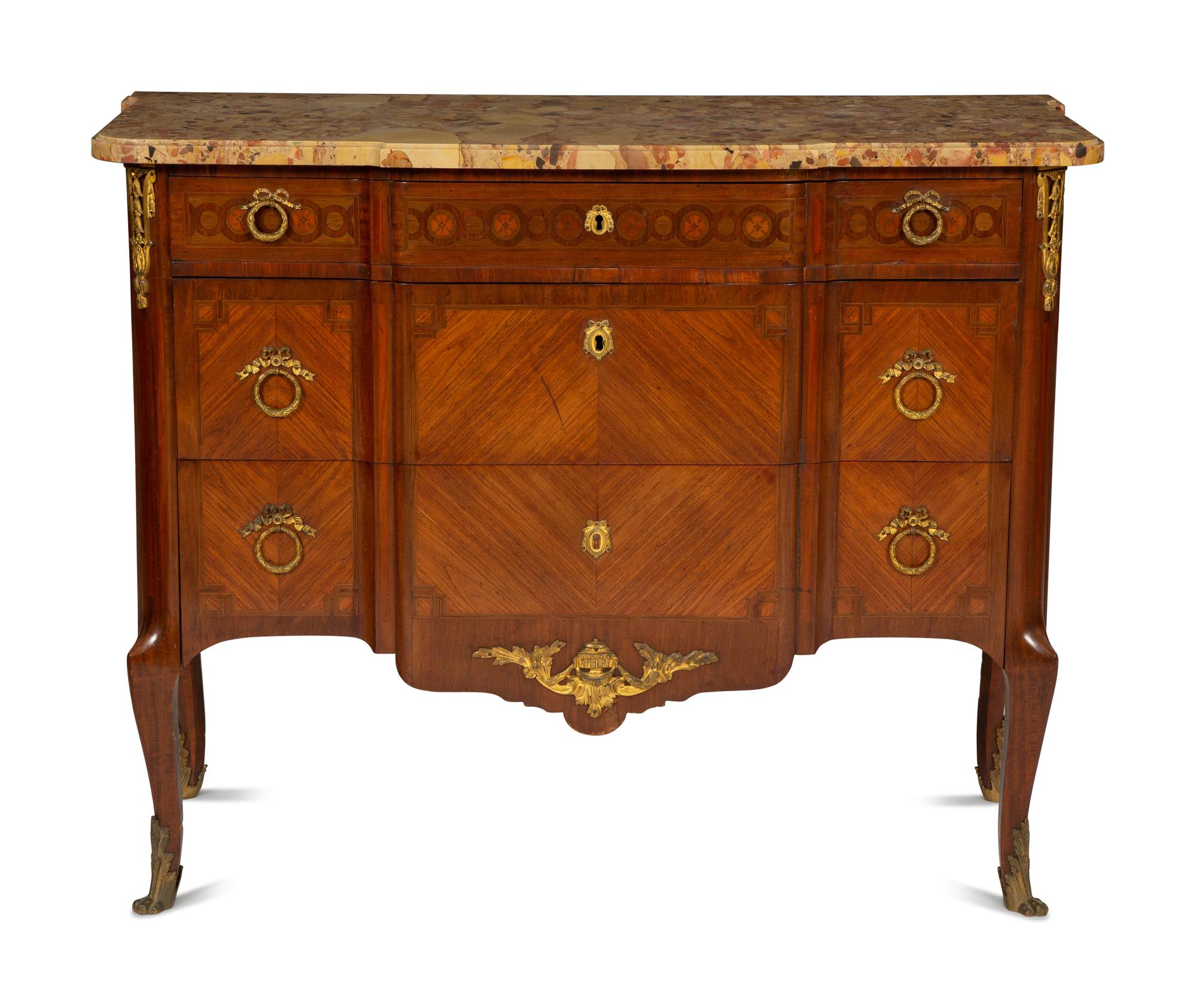 A French Gilt Metal Mounted Mahogany and Kingwood Marquetry Marble-Top Commode