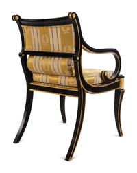 A Pair of Regency Style Parcel Gilt and Ebonized Armchairs
