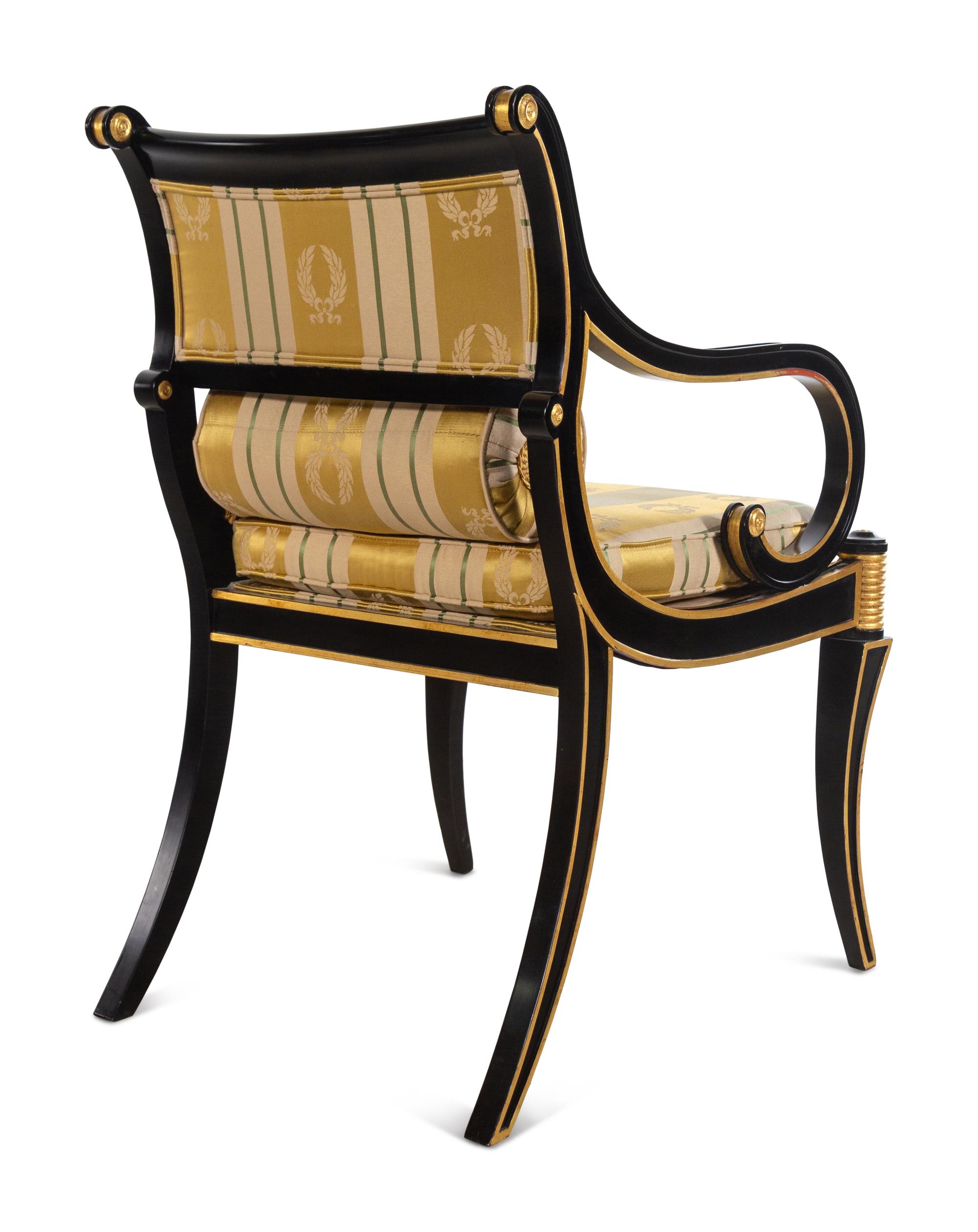 A Pair of Regency Style Parcel Gilt and Ebonized Armchairs