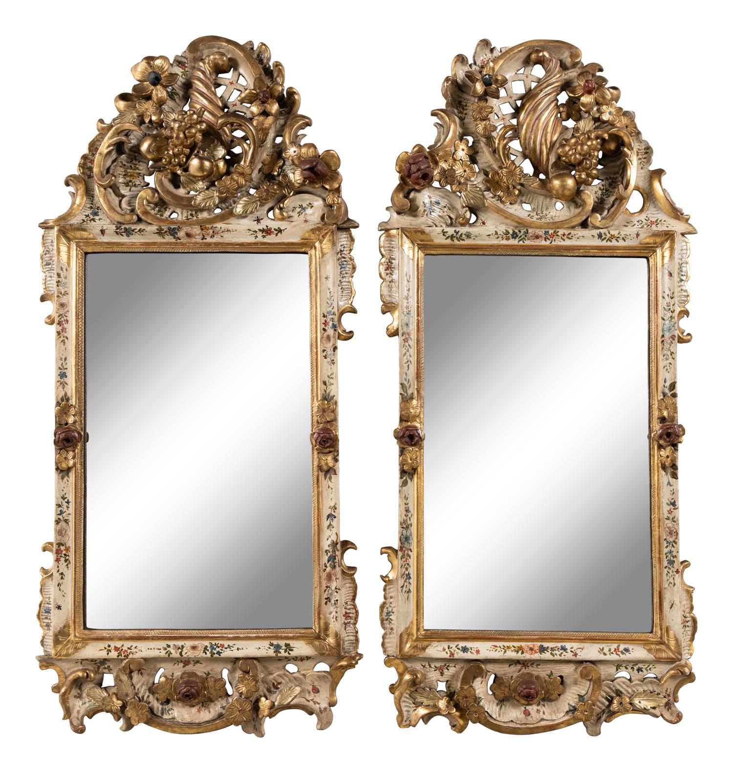 A Pair of South German Painted and Parcel Gilt Mirrors