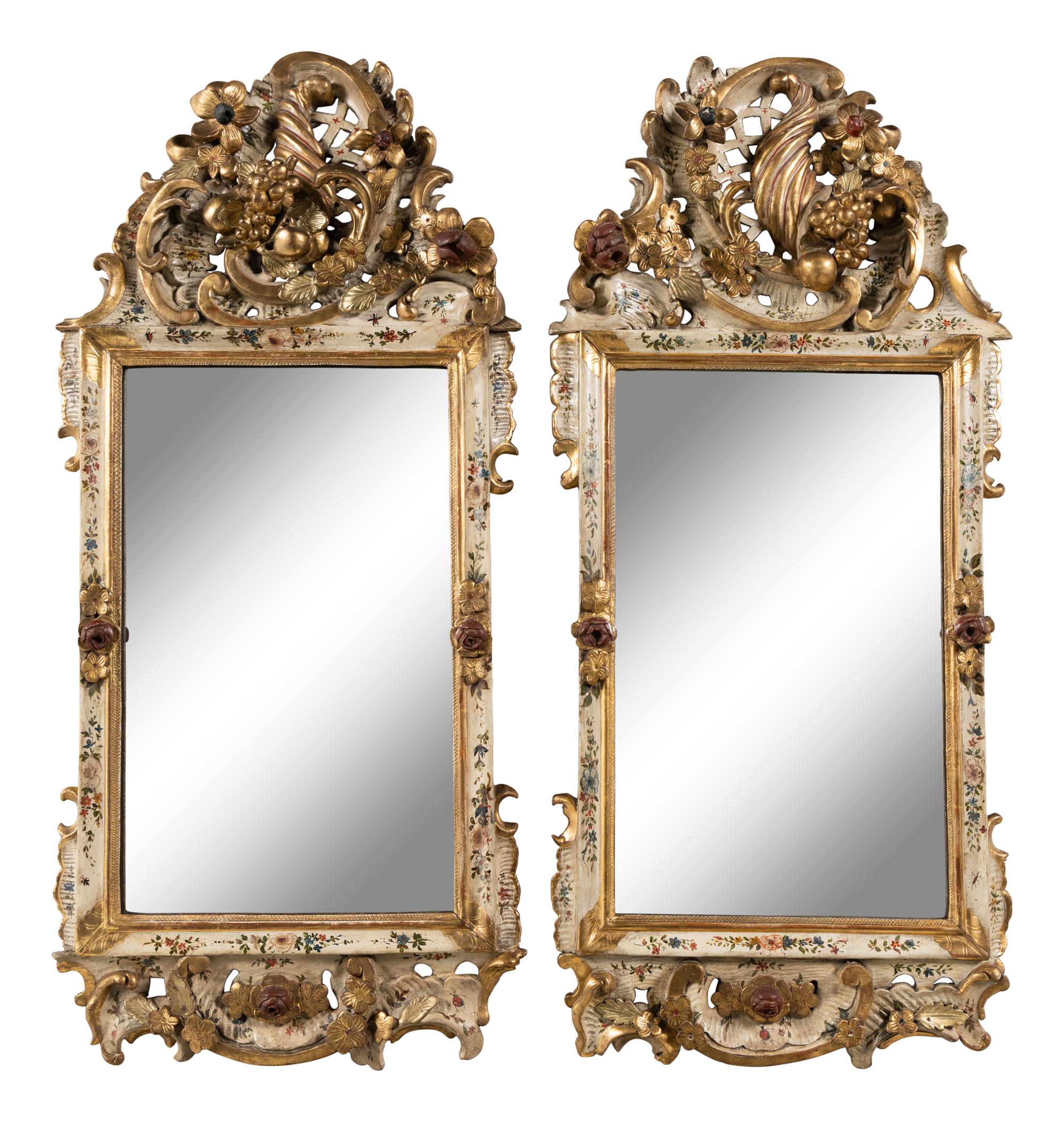 A Pair of South German Painted and Parcel Gilt Mirrors