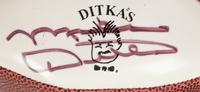 A Group Mike Ditka’s Restaurant Gift Shop Items Including Autograph Model Footballs Signed by Mike Ditka