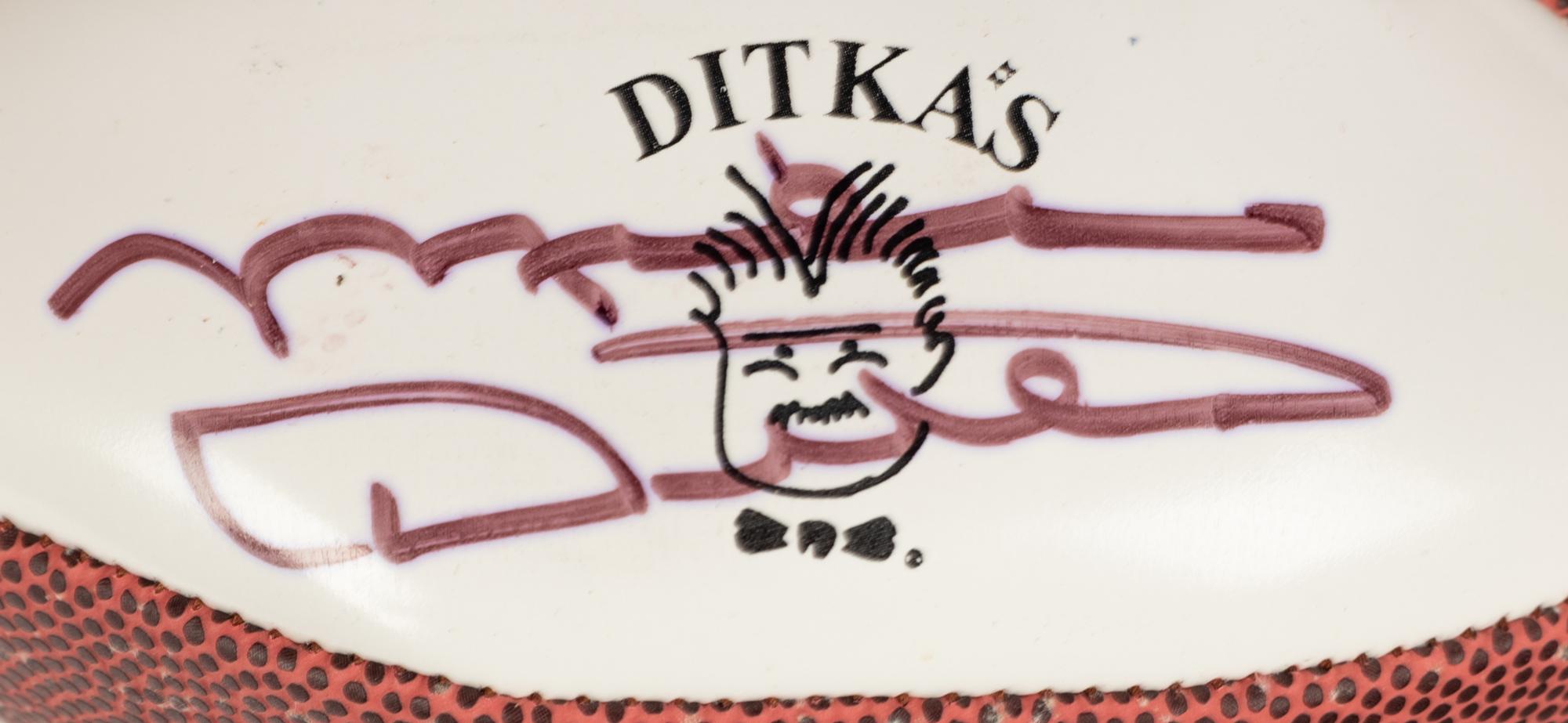 A Group Mike Ditka’s Restaurant Gift Shop Items Including Autograph Model Footballs Signed by Mike Ditka