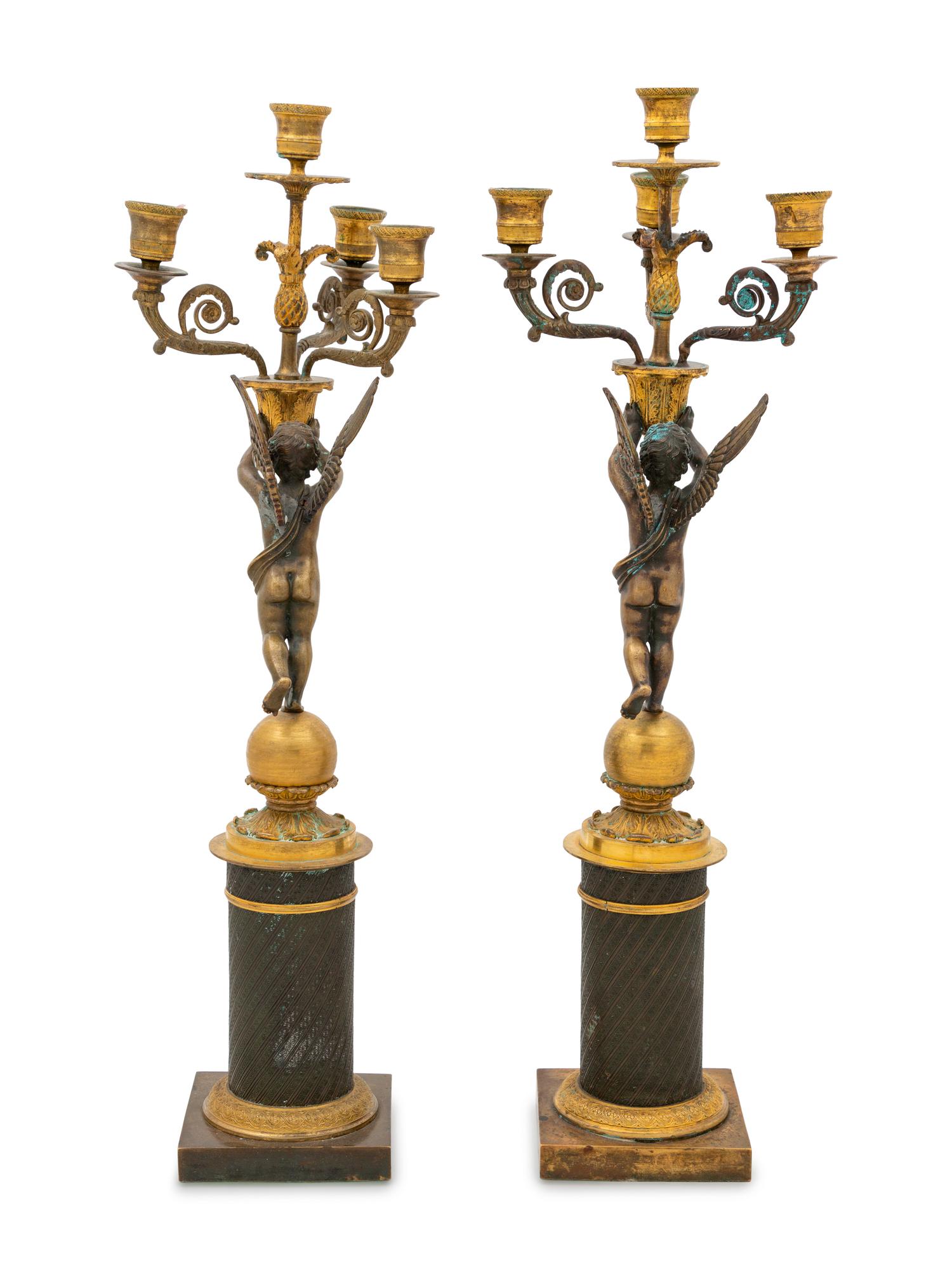A Pair of Empire Style Gilt and Patinated Bronze Figural Candelabra