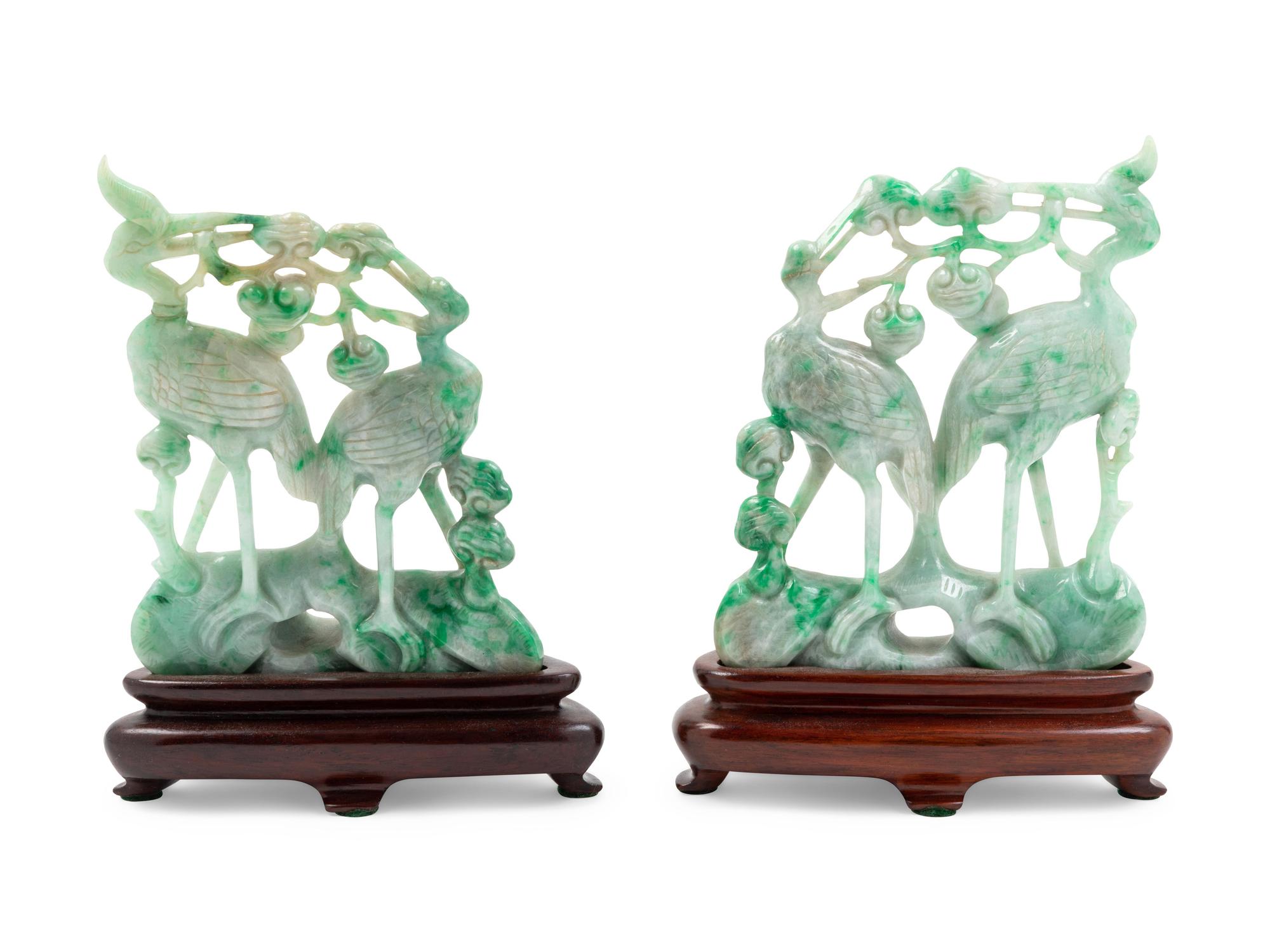 A Pair of Chinese Green and Celadon Jadeite Figural Groups of Cranes