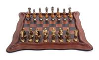 An Italian Leather Chess Set Dimensions of board 17 1/2 inches square.