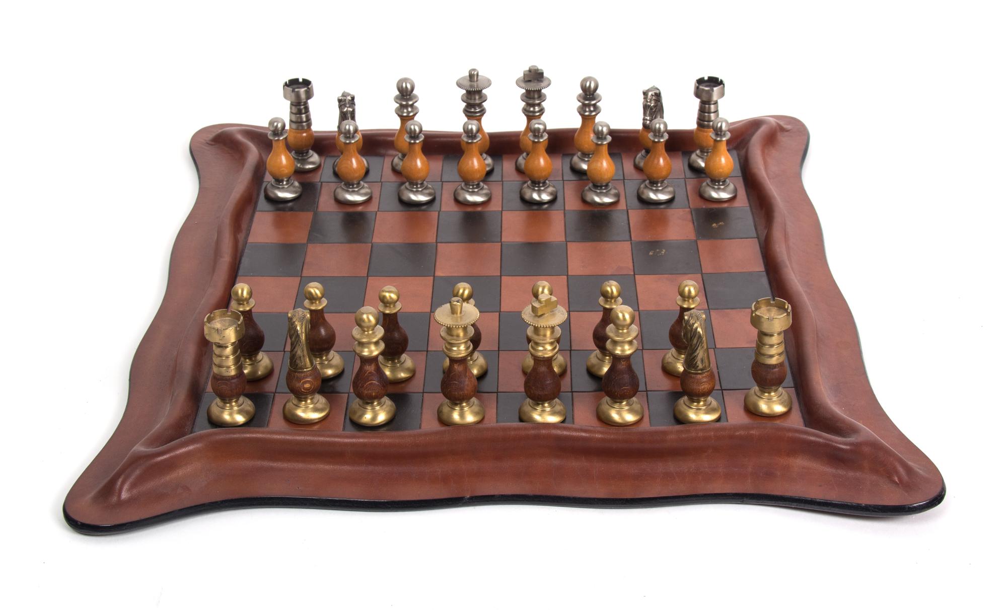 An Italian Leather Chess Set Dimensions of board 17 1/2 inches square.