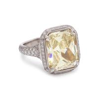 AN IMPRESSIVE FANCY YELLOW DIAMOND AND DIAMOND RING