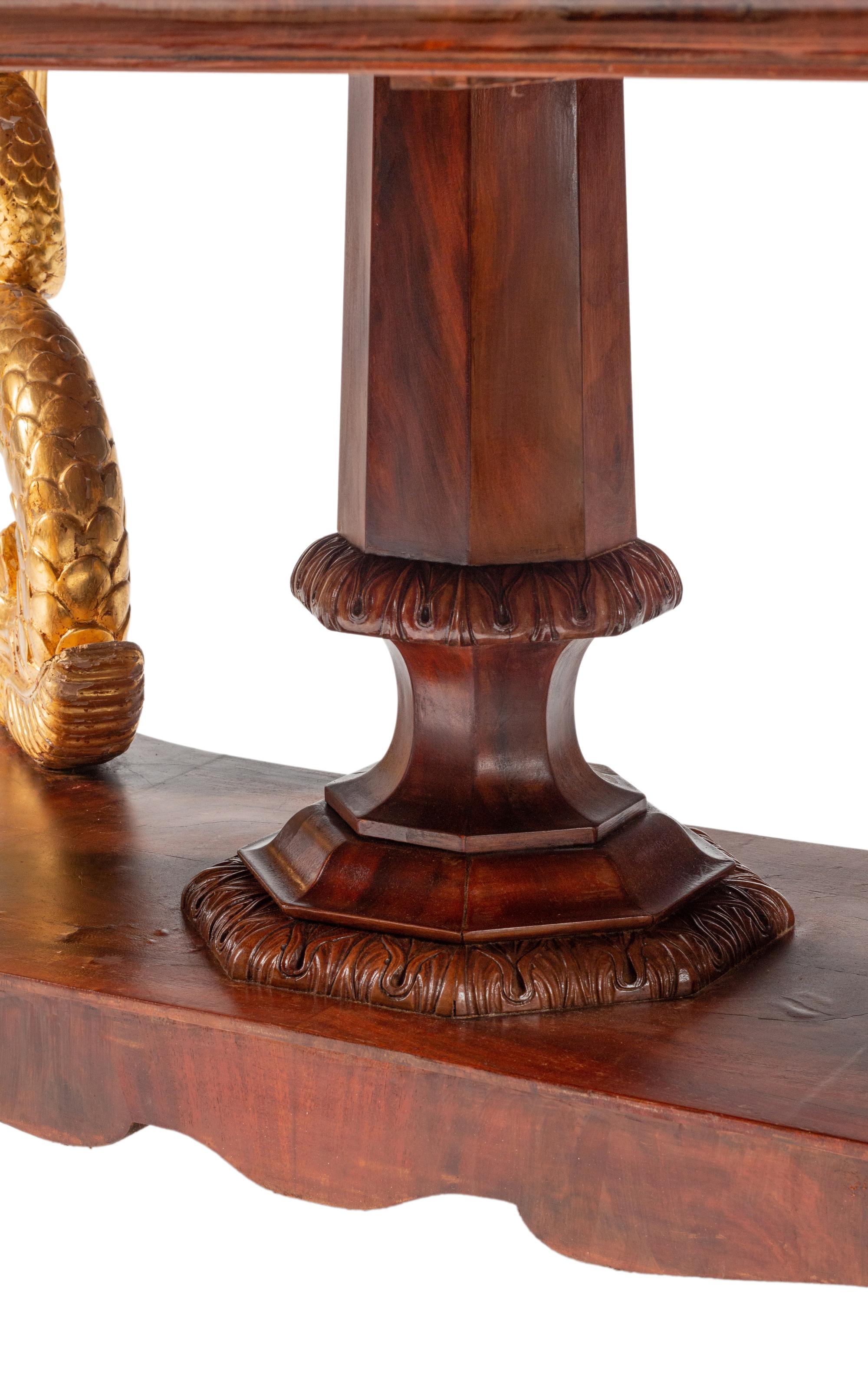 A North European Neoclassical Parcel Gilt Mahogany Center Table
