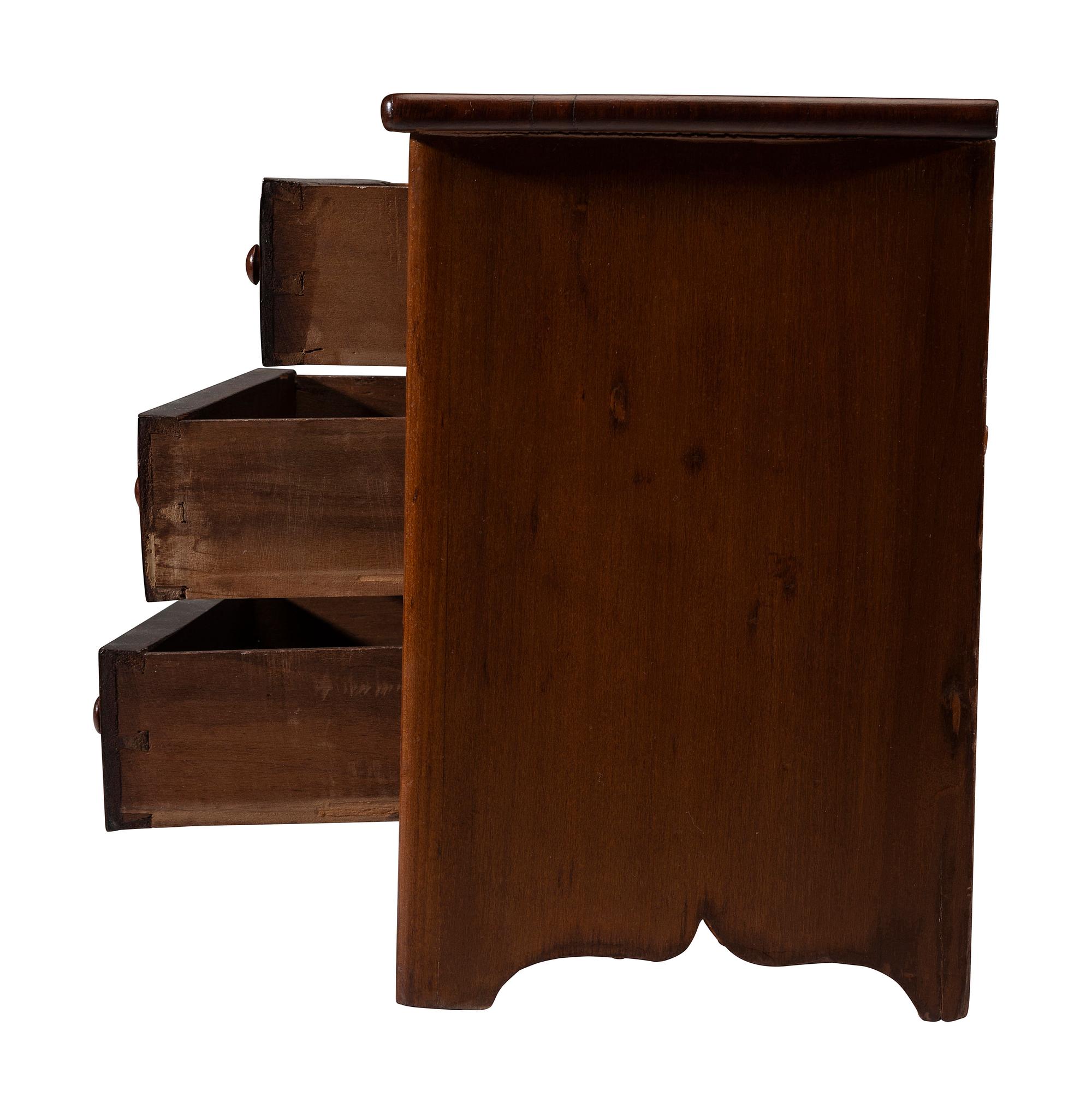 A Miniature Federal Three-Drawer Cherry Chest of Drawers