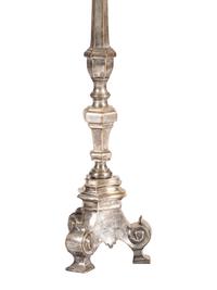 A Pair of Continental Baroque Style Silvered Brass Floor Candlestands