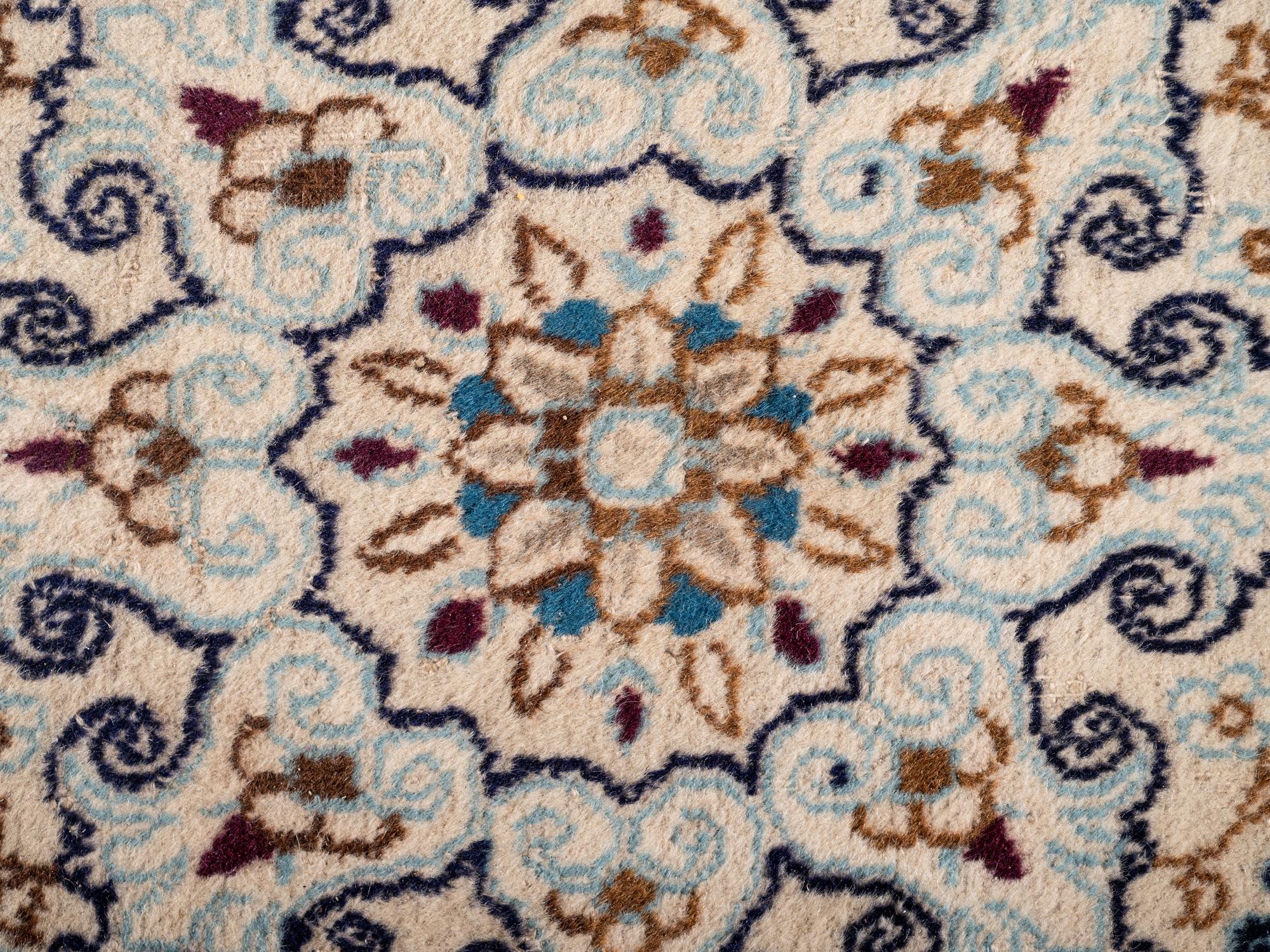 A Persian Nain Wool Rug