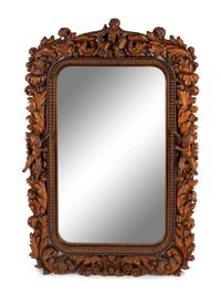 An Italian Carved Walnut Mirror