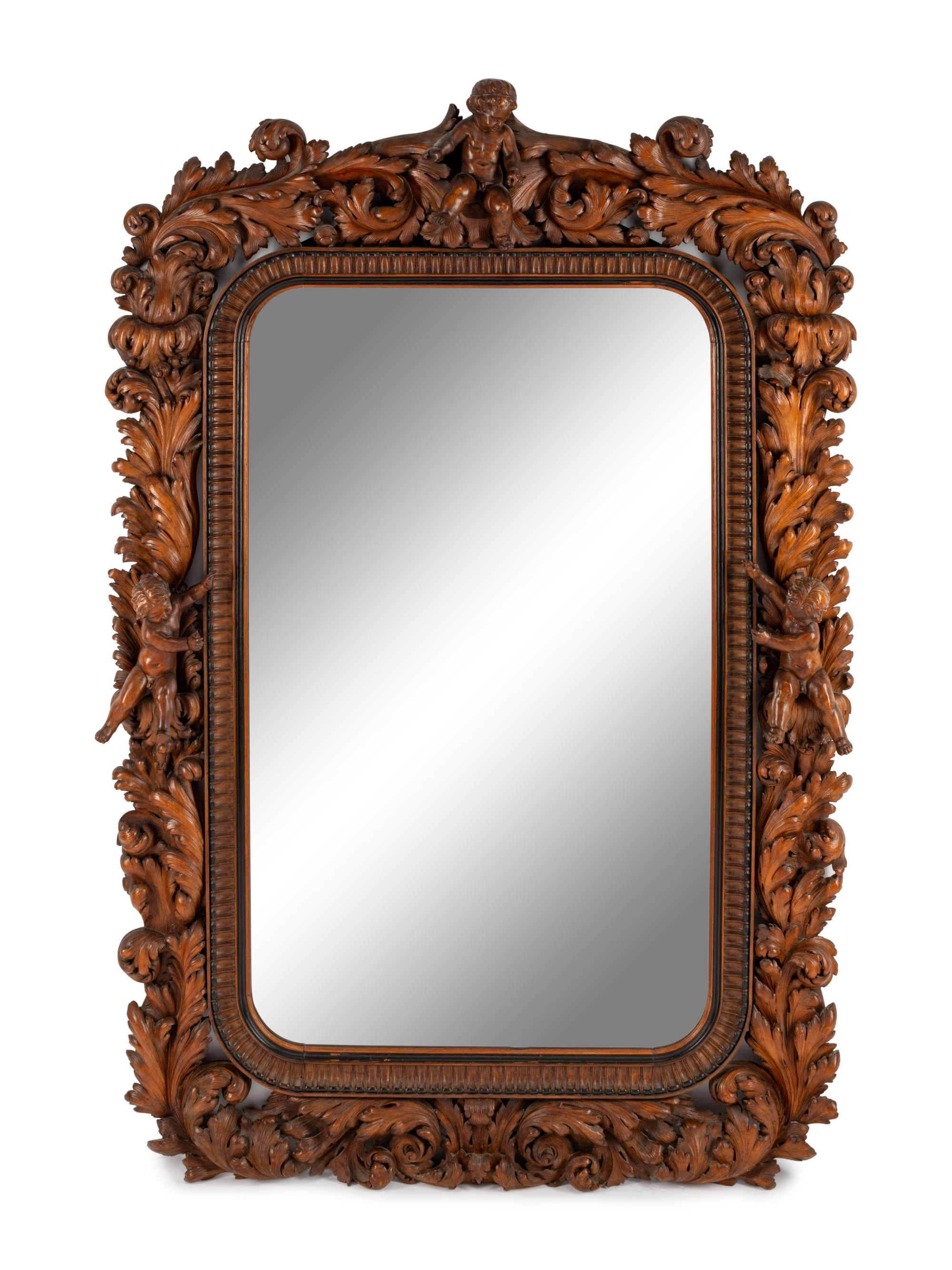 An Italian Carved Walnut Mirror