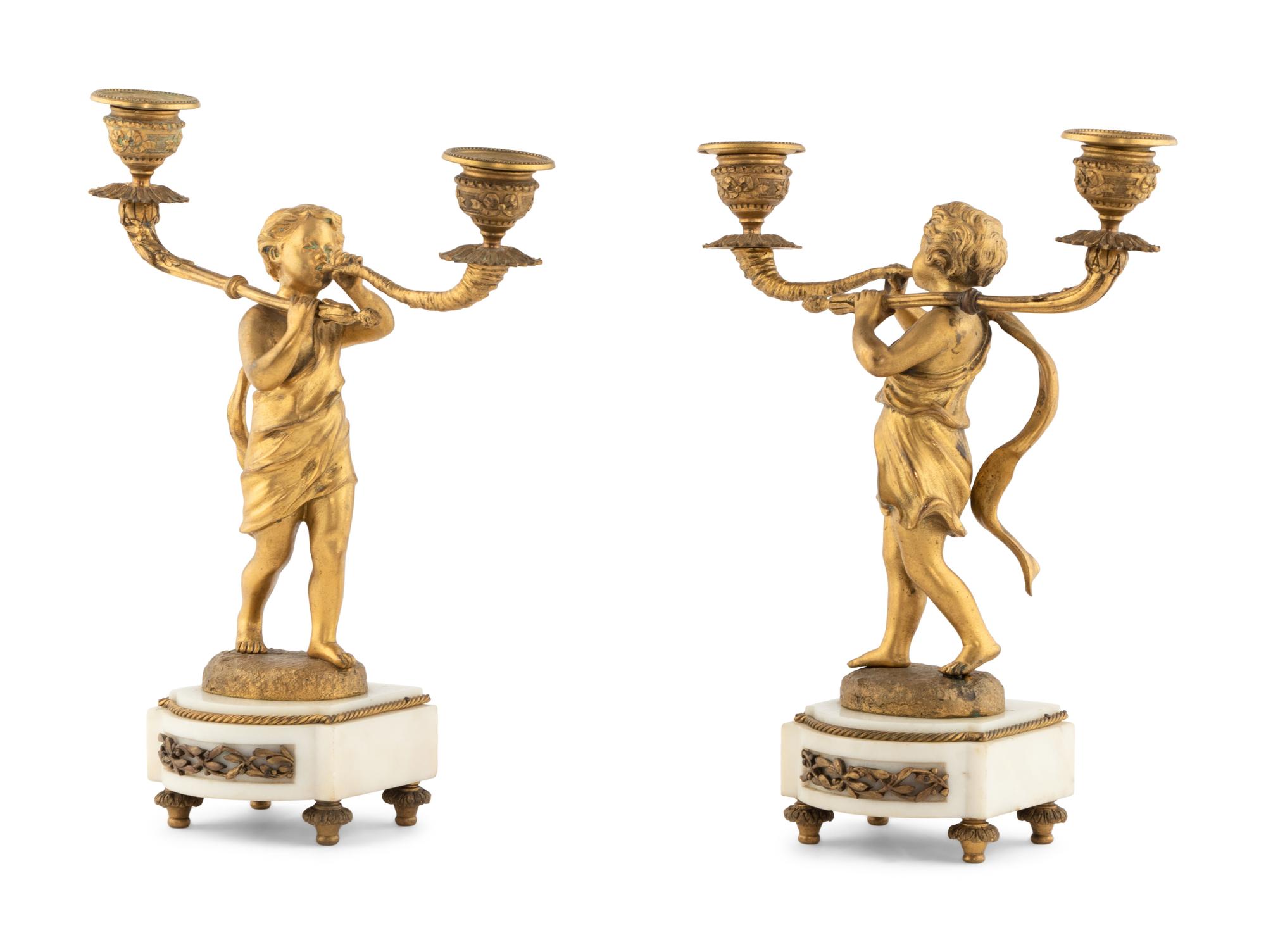A Pair of French Gilt Bronze Figural Two-Light Candelabra