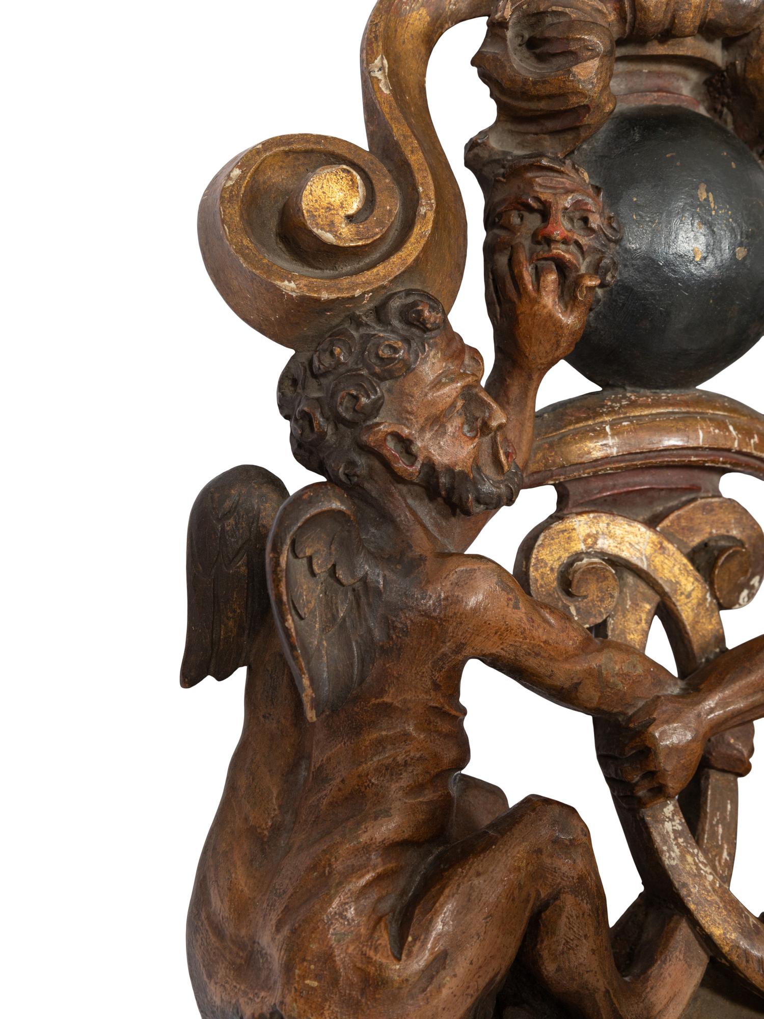 A Venetian Carved Walnut and Cast Iron Polychrome Decorated Three-Light Figural Sconce