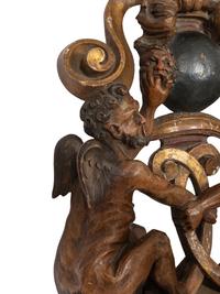 A Venetian Carved Walnut and Cast Iron Polychrome Decorated Three-Light Figural Sconce