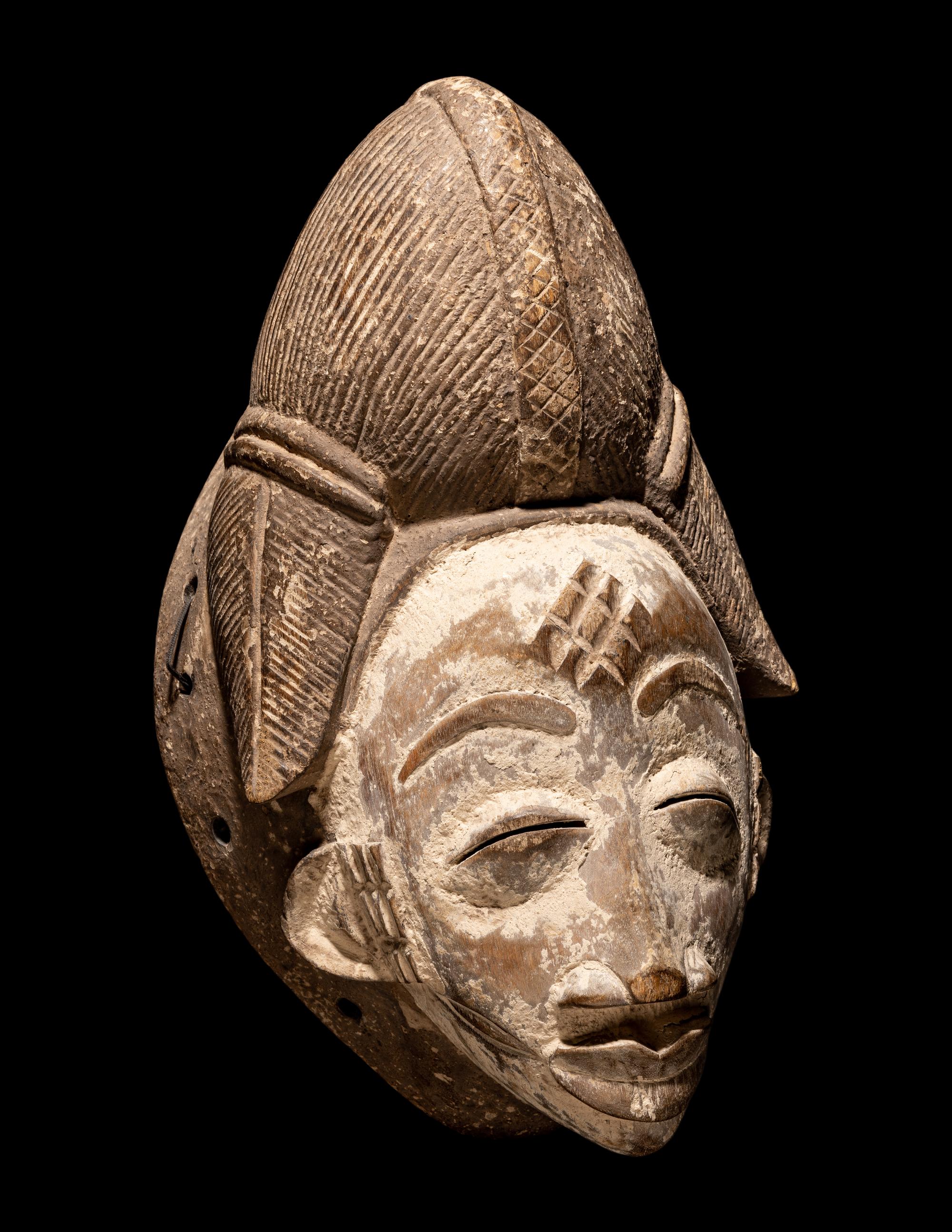 Four Punu Wood Masks