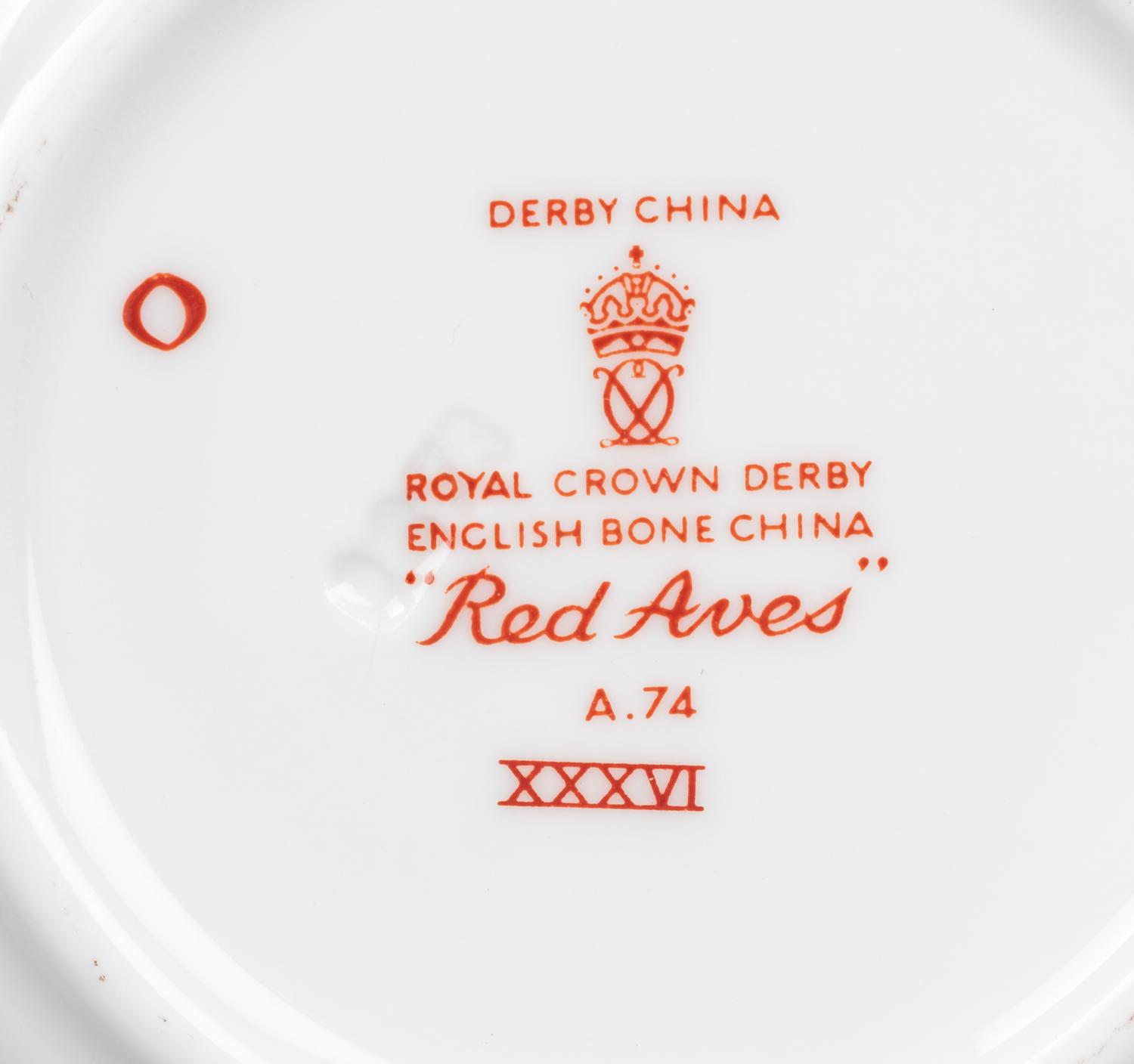 A Royal Crown Derby Red Aves Porcelain Dinner Service