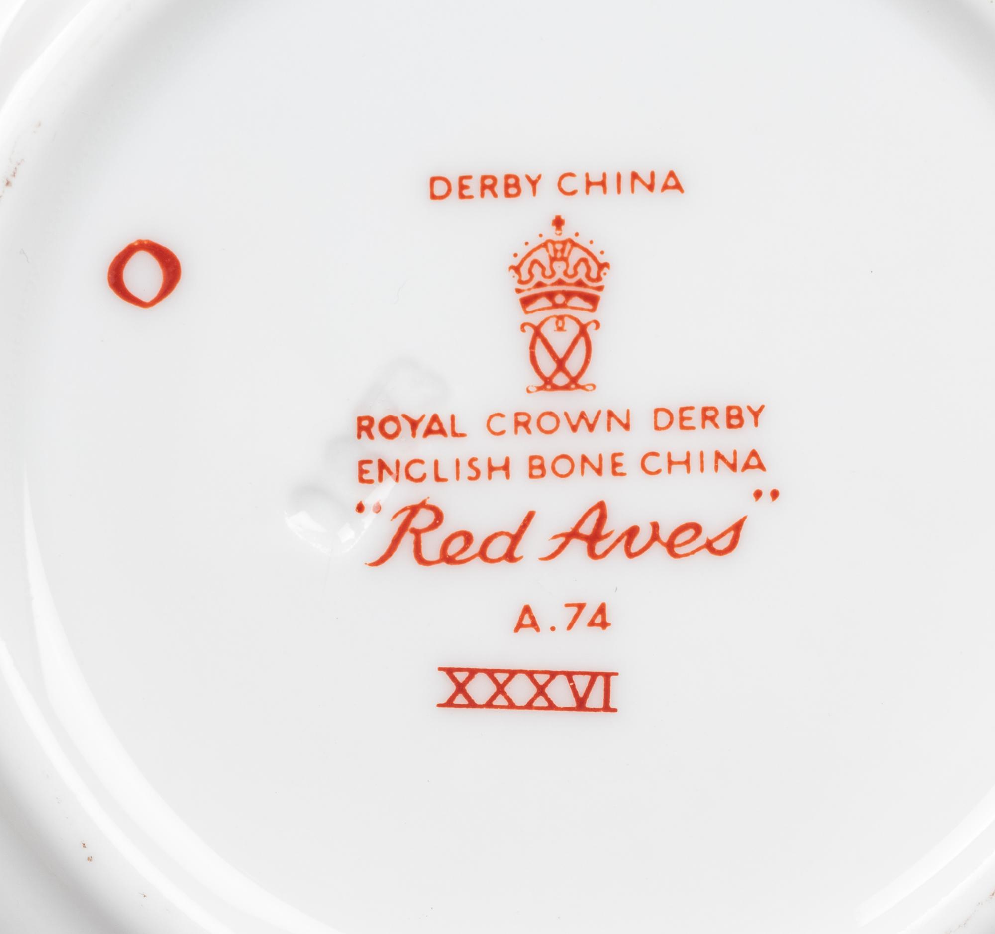 A Royal Crown Derby Red Aves Porcelain Dinner Service